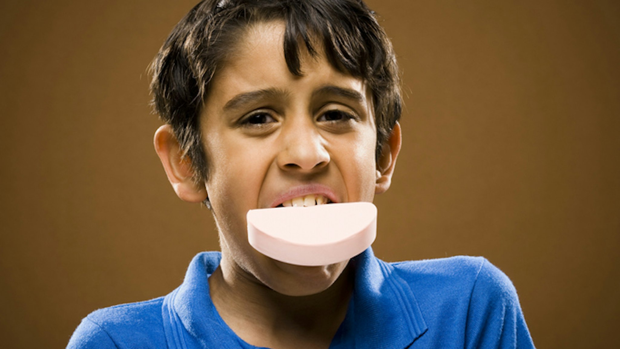 Image of boy with soap in mouth.