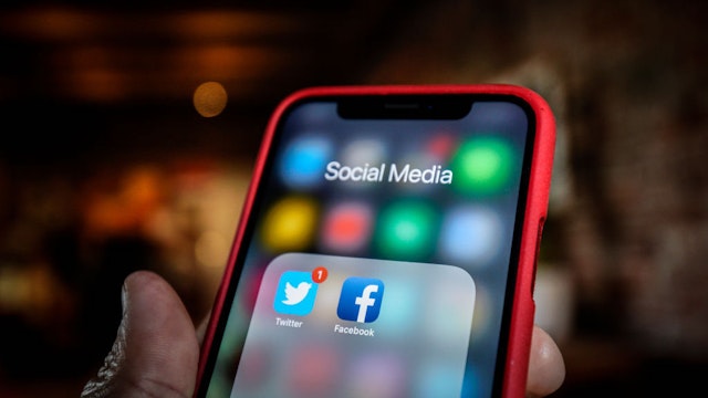 Twitter and Facebook applications are seen grouped in a Social Media folder on an iPhone in this photo illustration on March 17, 2019 in Warsaw, Poland.