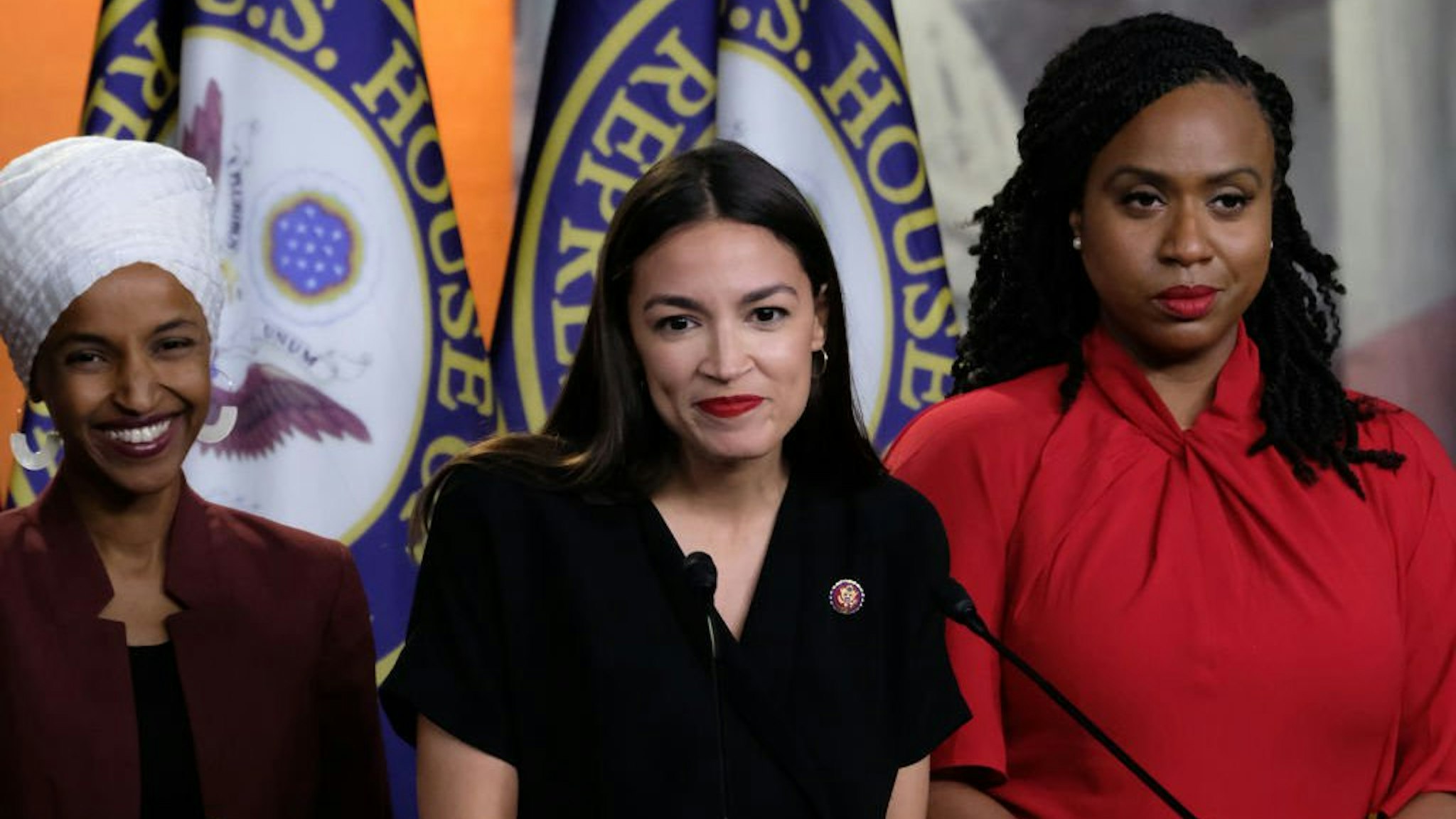 U.S. Rep. Alexandria Ocasio-Cortez (D-NY) pauses while speaking as Reps. Ilhan Omar (D-MN) and Ayanna Pressley (D-MA) listen during a news conference at the U.S. Capitol on July 15, 2019 in Washington, DC.