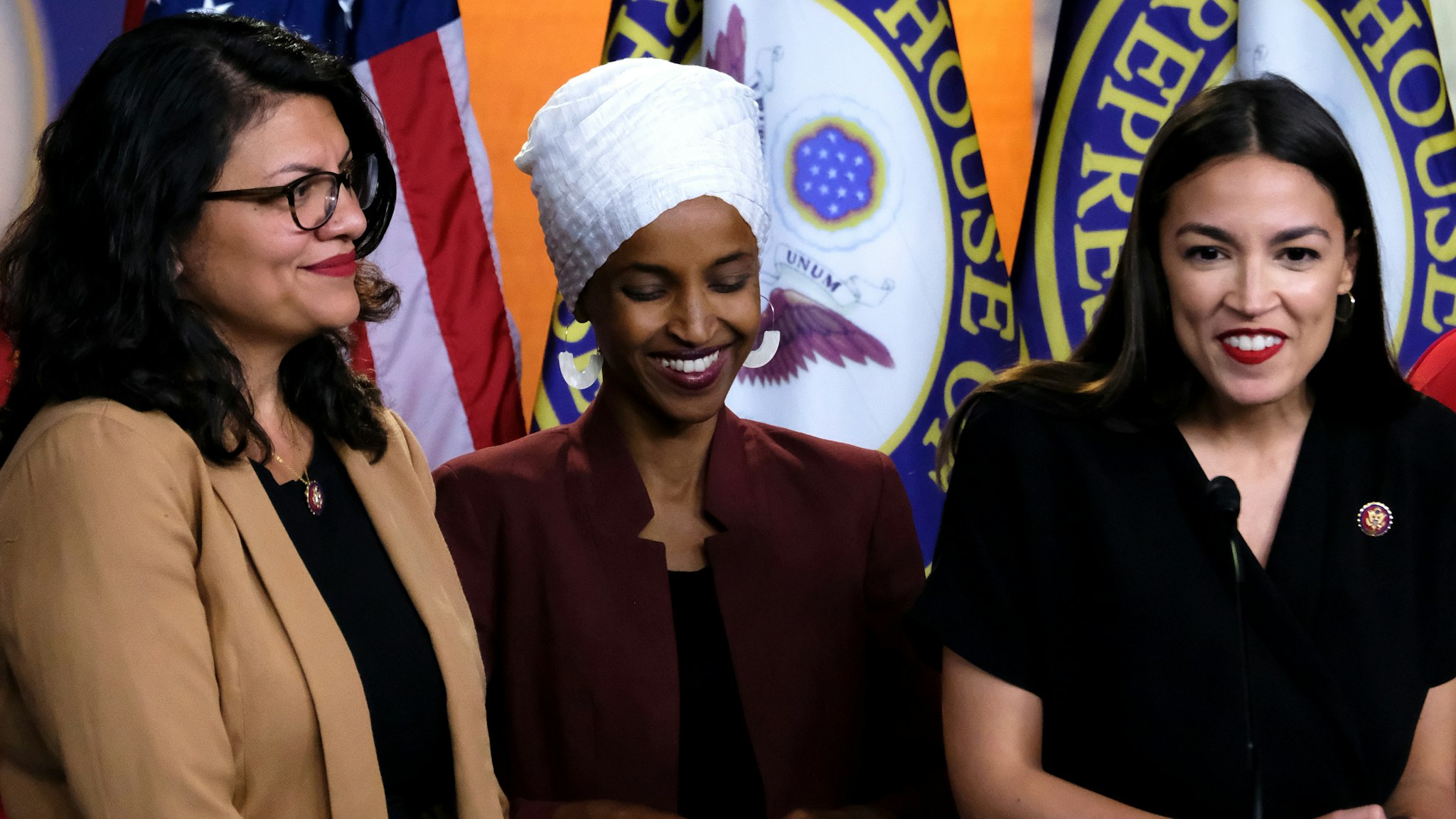 U.S. Reps. Rashida Tlaib (D-MI), Ilhan Omar (D-MN) and Alexandria Ocasio-Cortez (D-NY) listen during a news conference at the U.S. Capitol on July 15, 2019 in Washington, DC. President Donald Trump stepped up his attacks on the four progressive Democratic congresswomen, saying that if they're not happy in the U.S. "they can leave."