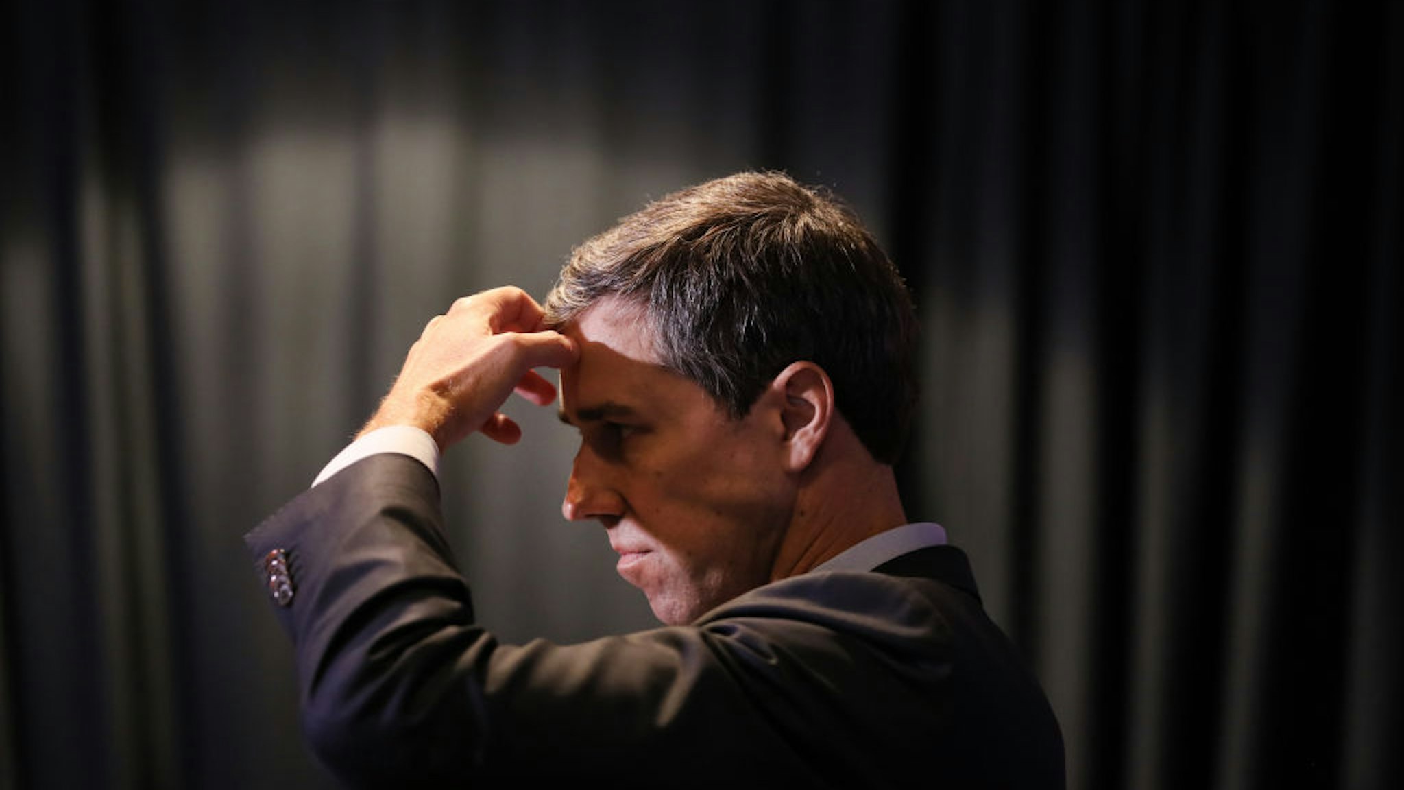 Beto O'Rourke listens to a question from the media at the SEIU Unions for All Summit