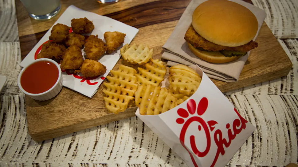 Chick-fil-A Chicken nuggets, french fries, and a fried chicken sandwich are arranged for a photograph during an event ahead of the grand opening for a Chick-fil-A restaurant in New York, U.S., on Friday, Oct. 2, 2015. Chick-fil-A, the Southern chicken-sandwich chain that has drawn both controversy and copycats over the years, has finally arrived in New York. The company will open a 5,000-square-foot (465-square-meter), three-level restaurant in Manhattan's Garment District that will be the chain's largest location in the nation.