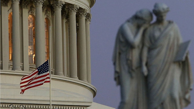 A flag at the U.S. Capitol flies at half staff after President Barack Obama ordered the action while speaking on the shootings at the Sandy Hook Elementary School December 14, 2012 in Washington, DC.