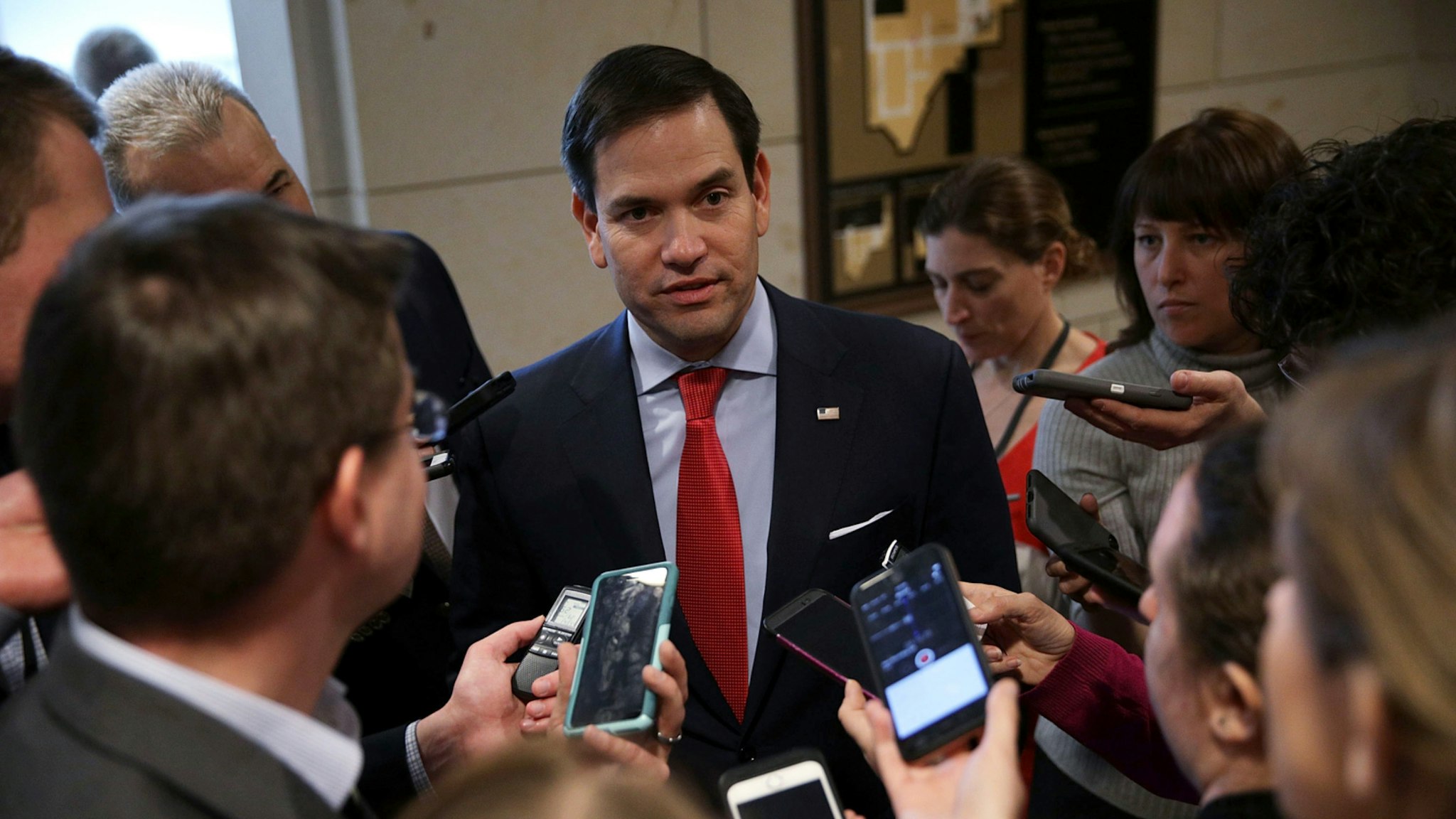 Marco Rubio (R-FL) talks to members of the media as he leaves after a closed briefing on the airstrikes against Syria by Chairman of the Joint Chiefs Gen. Joe Dunford April 7, 2017 at the Capitol in Washington, DC.