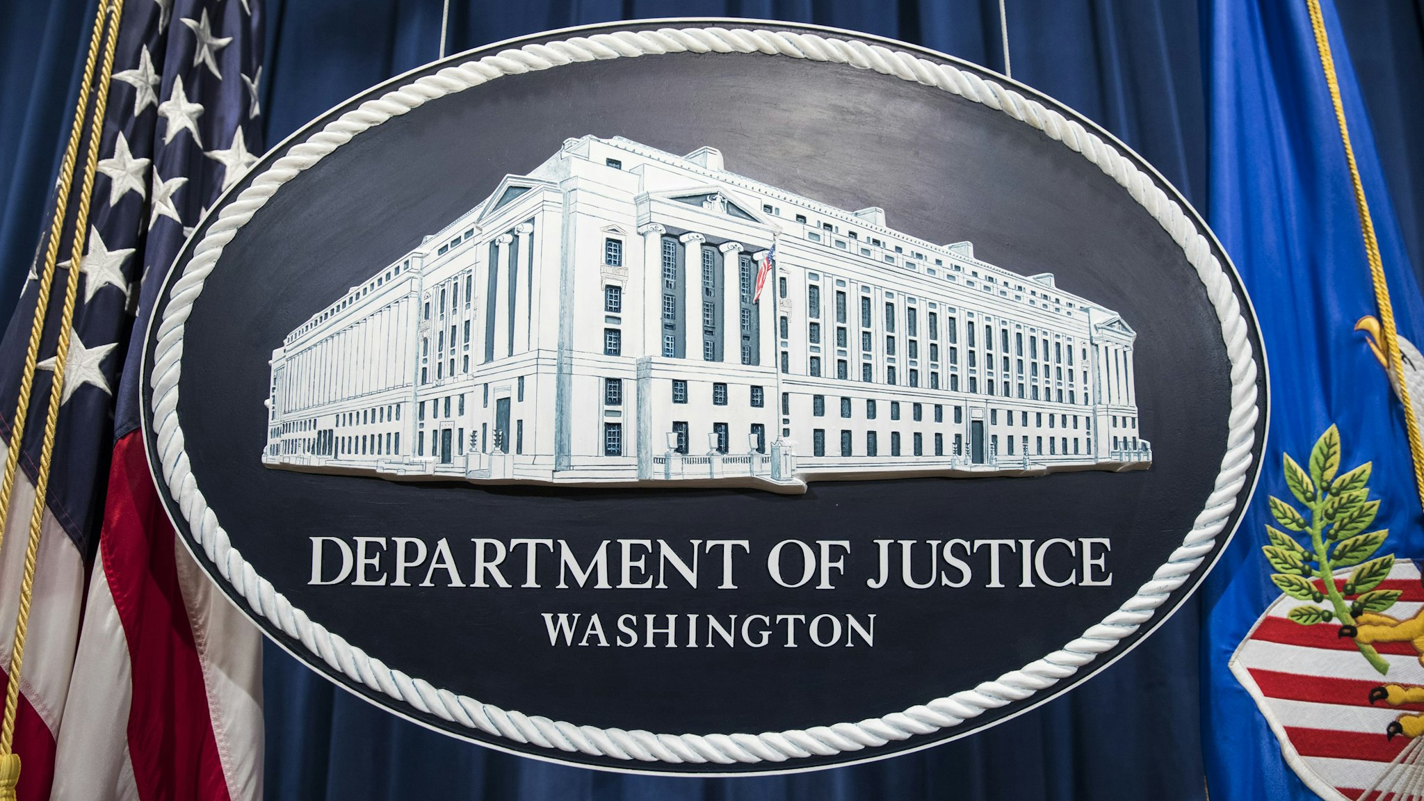 The Department of Justice logo hangs as the backdrop before a press conference held by Attorney General Jeff Sessions on leaks of classified material threatening national security in Washington, USA on August 4, 2017.