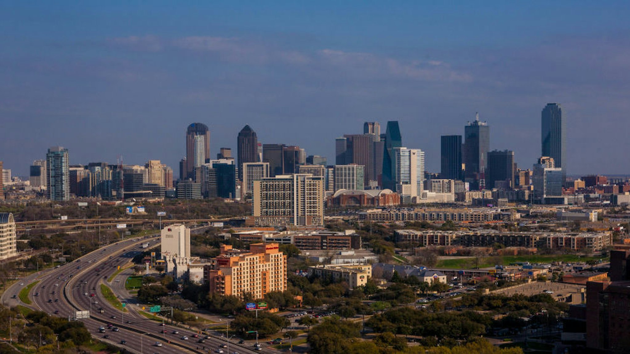 The downtown skyline is viewed from the Renaissance Hotel off Stemmons Highway on March 20, 2013 in Dallas, Texas. Dallas, a major hub of technology, energy, medical research, and commerce, is the fourth largest metropolitan center in the United States. (Photo by George Rose/Getty Images)