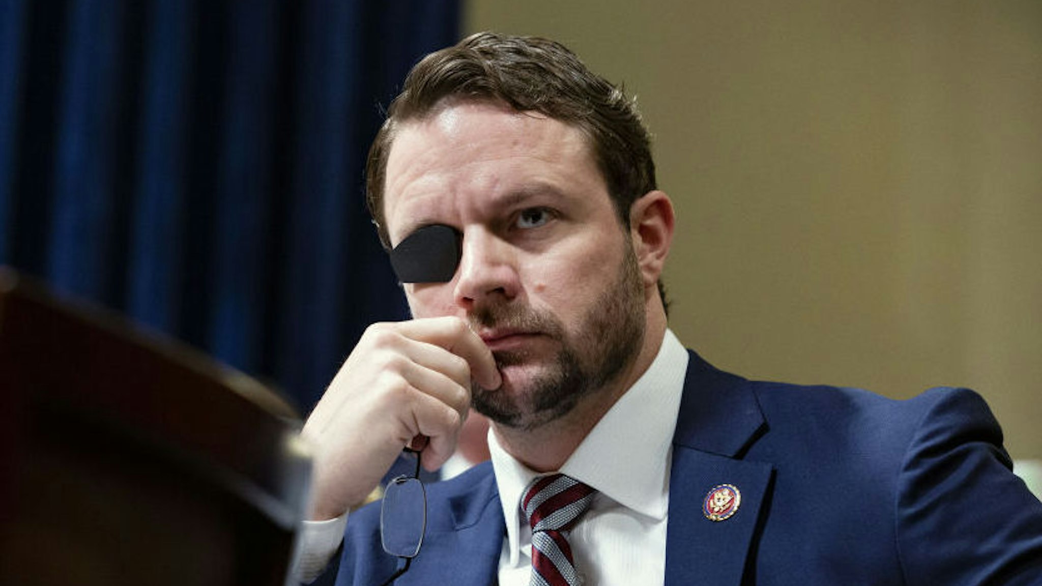 Representative Dan Crenshaw, a Republican from Texas, listens during a House Homeland Security Committee hearing in Washington, D.C., U.S., on Wednesday, June 26, 2019. Google's global director of information policy testified Wednesday that no single employee could skew search results based on her political beliefs. Photographer: Anna Moneymaker/Bloomberg