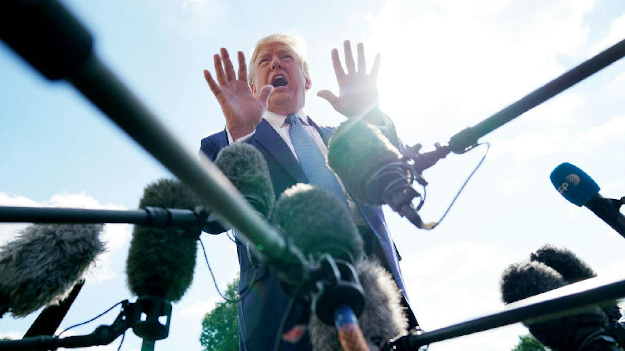 U.S. President Donald Trump talks to journalists on the South Lawn of the White House before boarding Marine One and traveling to Walter Reed National Military Medical Center October 04, 2019 in Washington, DC. According to the White House, Trump will be visiting injured military service members. (Photo by Chip Somodevilla/Getty Images)