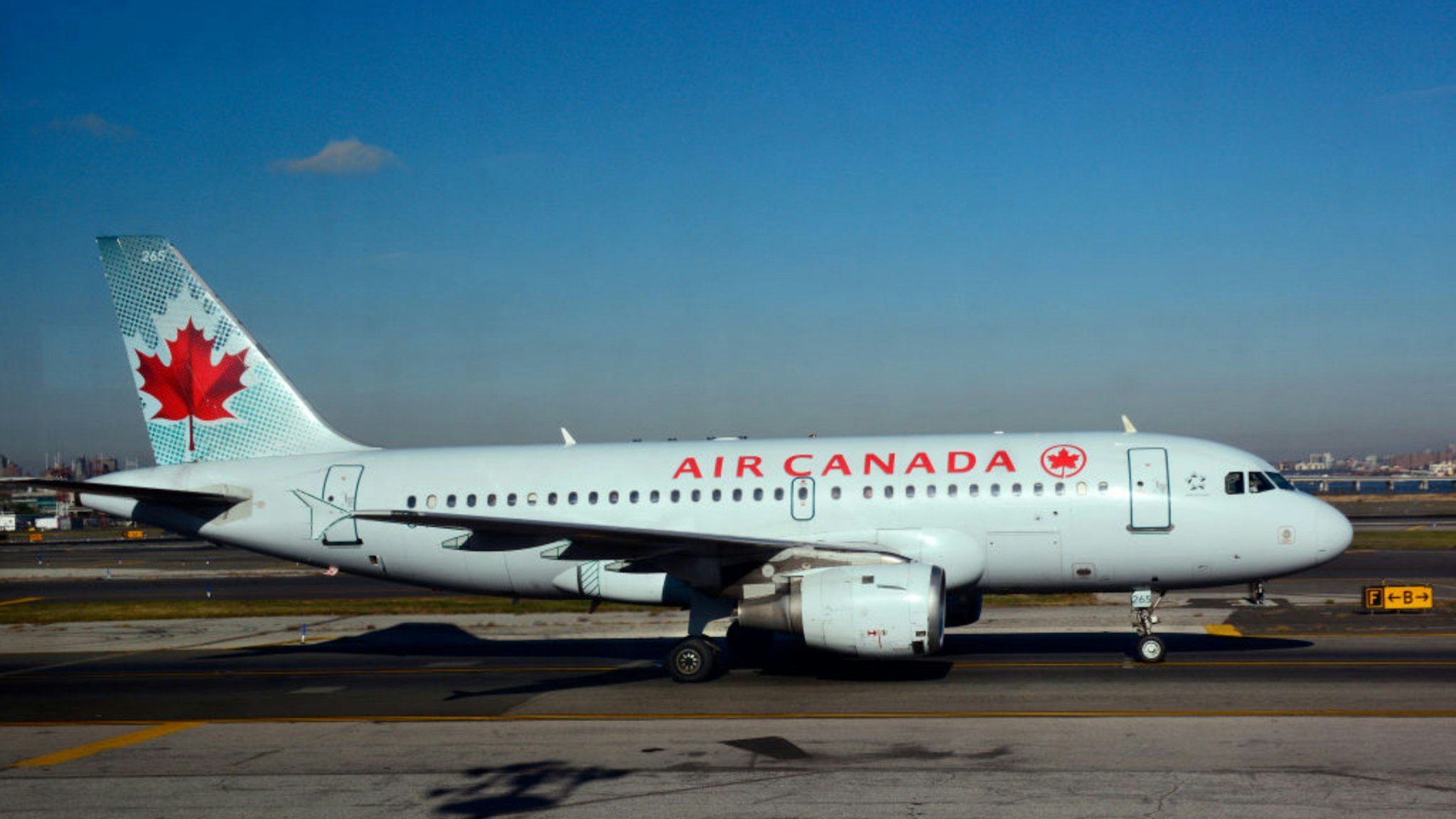 An Air Canada Express passenger jet lands at LaGuardia Airport in New York, New York.