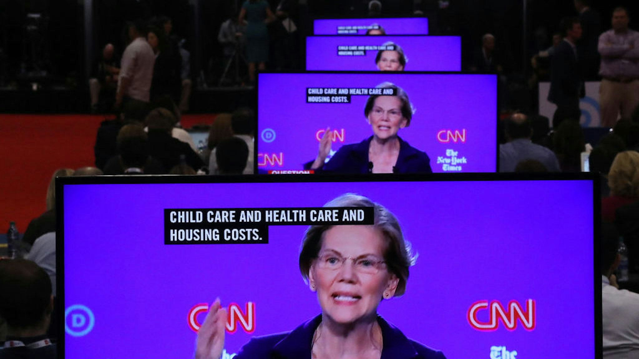 Sen. Elizabeth Warren (D-MA) appear on television screens in the Media Center during the Democratic Presidential Debate at Otterbein University on October 15, 2019 in Westerville, Ohio. A record 12 presidential hopefuls are participating in the debate hosted by CNN and The New York Times. (Photo by Chip Somodevilla/Getty Images)