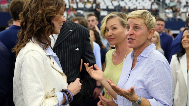 Charlotte Jones-Anderson visits with Ellen DeGeneres and Portia de Rossi before the game between the Green Bay Packers and Dallas Cowboys at AT&amp;T Stadium on October 06, 2019 in Arlington, Texas. (Photo by Richard Rodriguez/Getty Images)