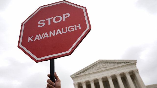 A "STOP KAVANAUGH" sign is seen during a protest against the confirmation of Supreme Court nominee Judge Brett Kavanaugh, outside of the Supreme Court, October 6, 2018 in Washington, DC. The Senate is set to hold a final vote Saturday evening to confirm the nomination of Judge Brett Kavanaugh to the U.S. Supreme Court.