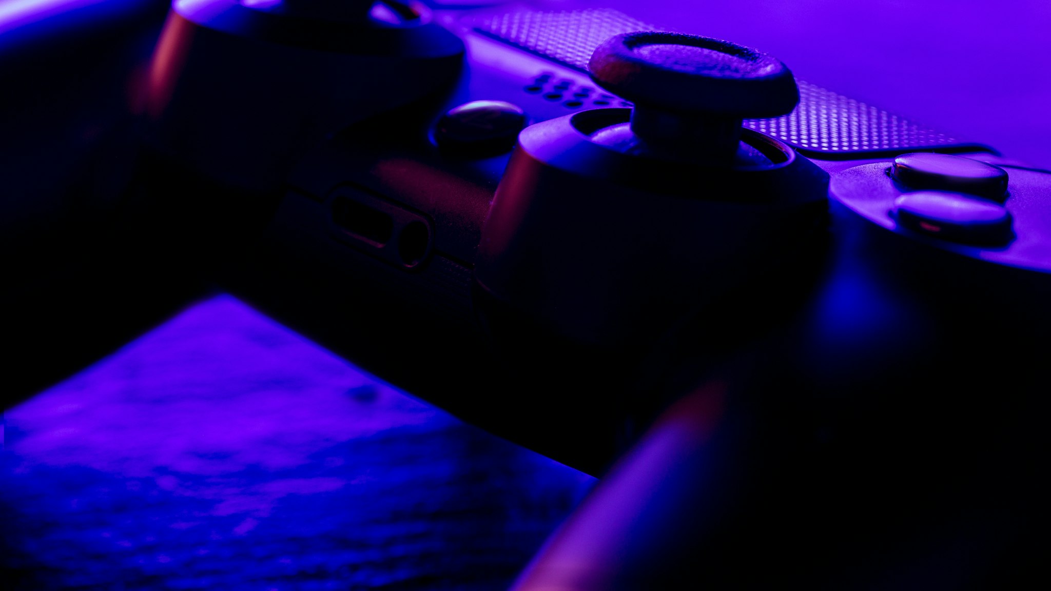 Close-Up Of Game Controller On Table - stock photo