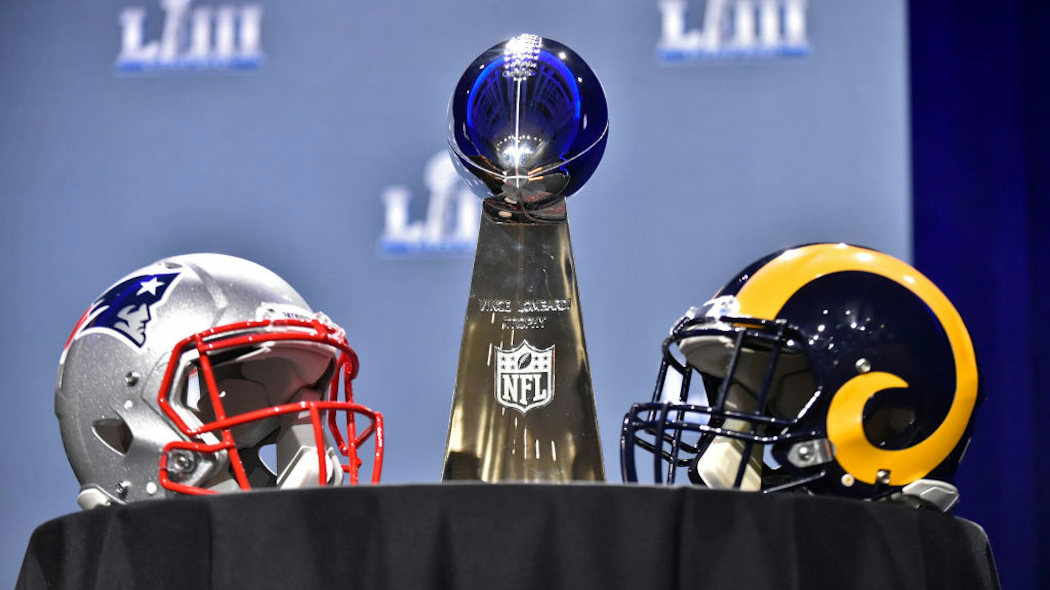 The Vince Lombardi Trophy sits on a table between the New England Patriots and Los Angeles Rams helmets prior to NFL Commissioner Roger Goodell's press conference at the Georgia World Congress Center on January 30, 2019, in Atlanta, GA.