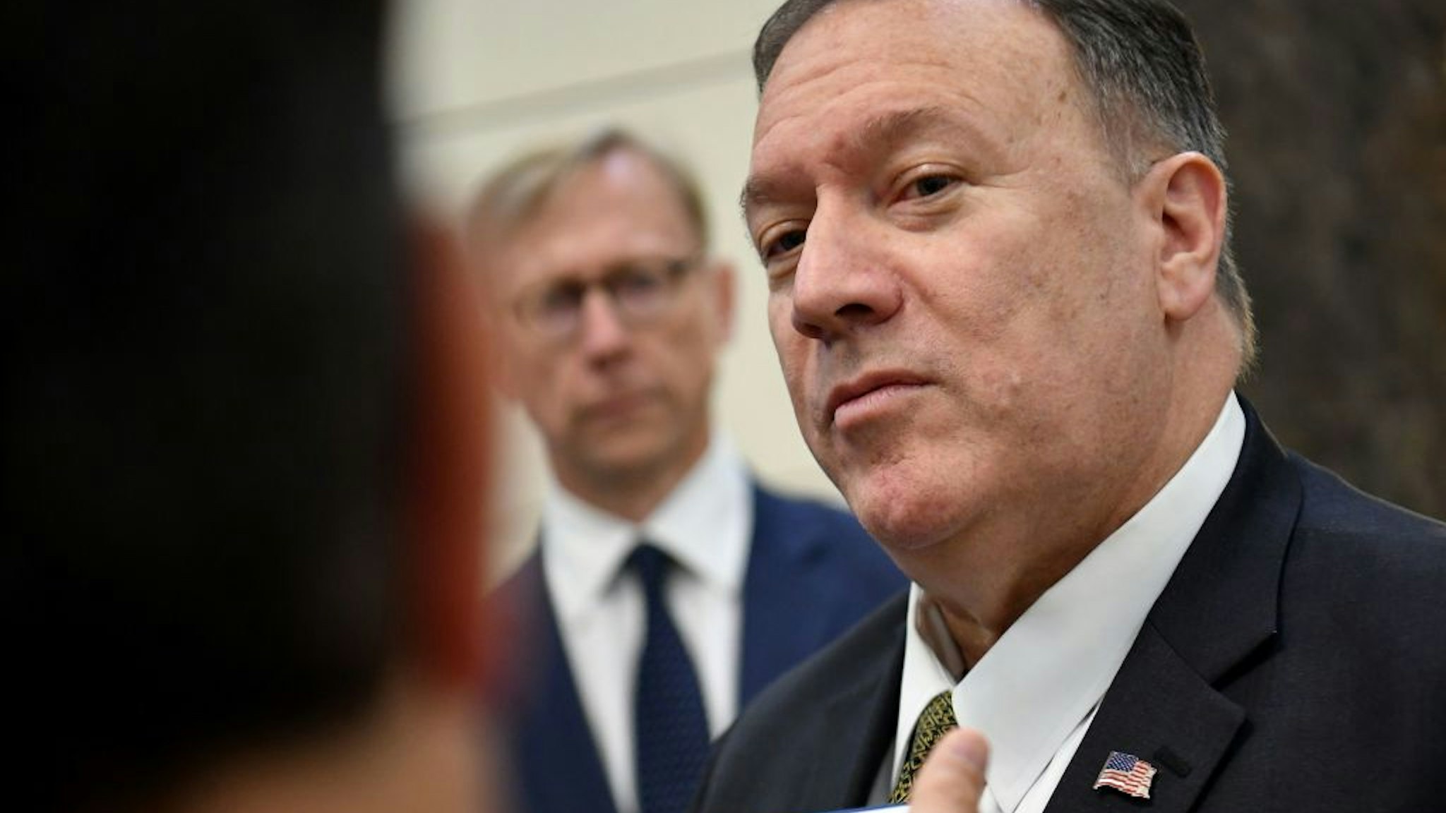 US Secretary of State Mike Pompeo speaks to reporters before departing from al-Bateen Air Base in Abu Dhabi on September 19, 2019.