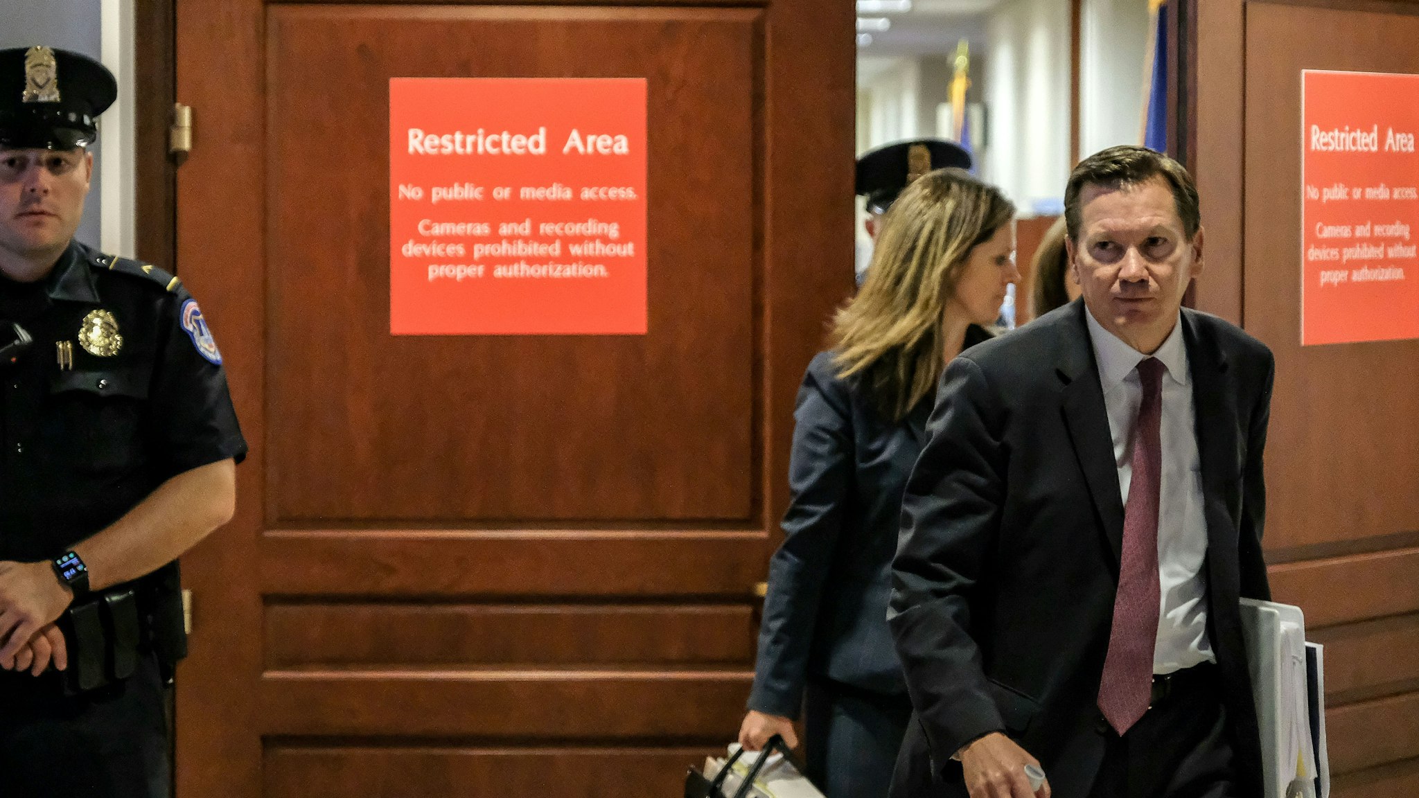 Intelligence Community Inspector General Michael Atkinson, right, leaves a closed briefing with the House Intelligence Committee on Capitol Hill in Washington, D.C., U.S., on Friday, Oct. 4, 2019.