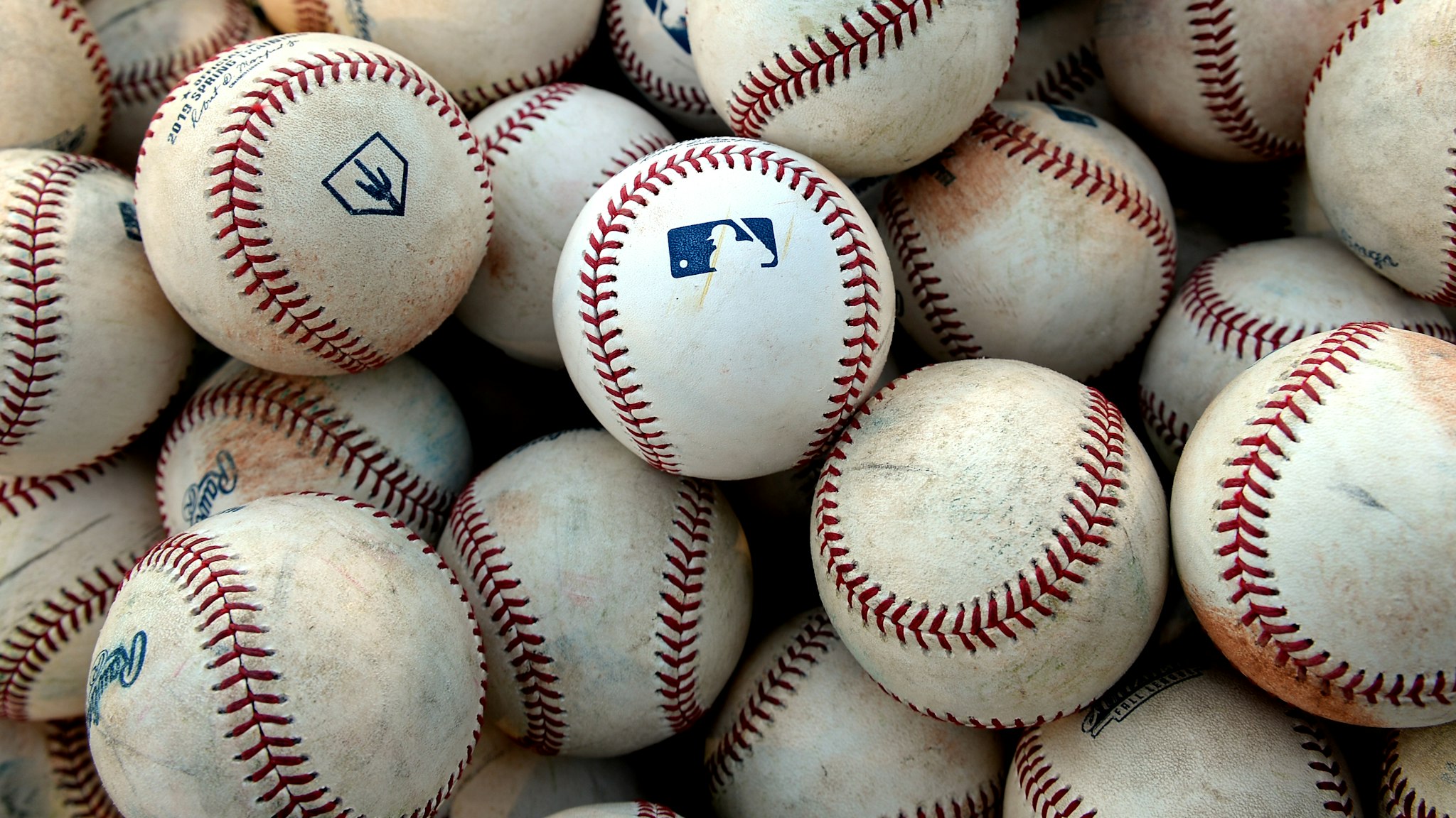 A detail shot of the MLB logo on batting practice balls before the game against the Peoria Javelinas and the Mesa Solar Sox at Sloan Park on Saturday, September 21, 2019 in Mesa, Arizona. (Photo by Jill Weisleder/MLB Photos via Getty Images)