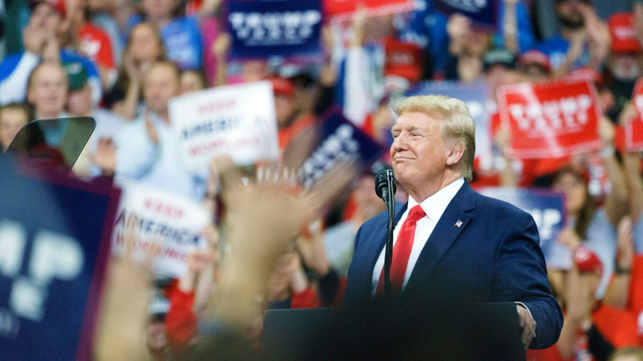 U.S. President Donald Trump reacts during a rally in Minneapolis, Minnesota, U.S., on Thursday, Oct. 10, 2019. Trump said the first day of high-level trade negotiations between the U.S. and China on Thursday went "very well" and that he plans to meet with the top Chinese negotiator Friday.