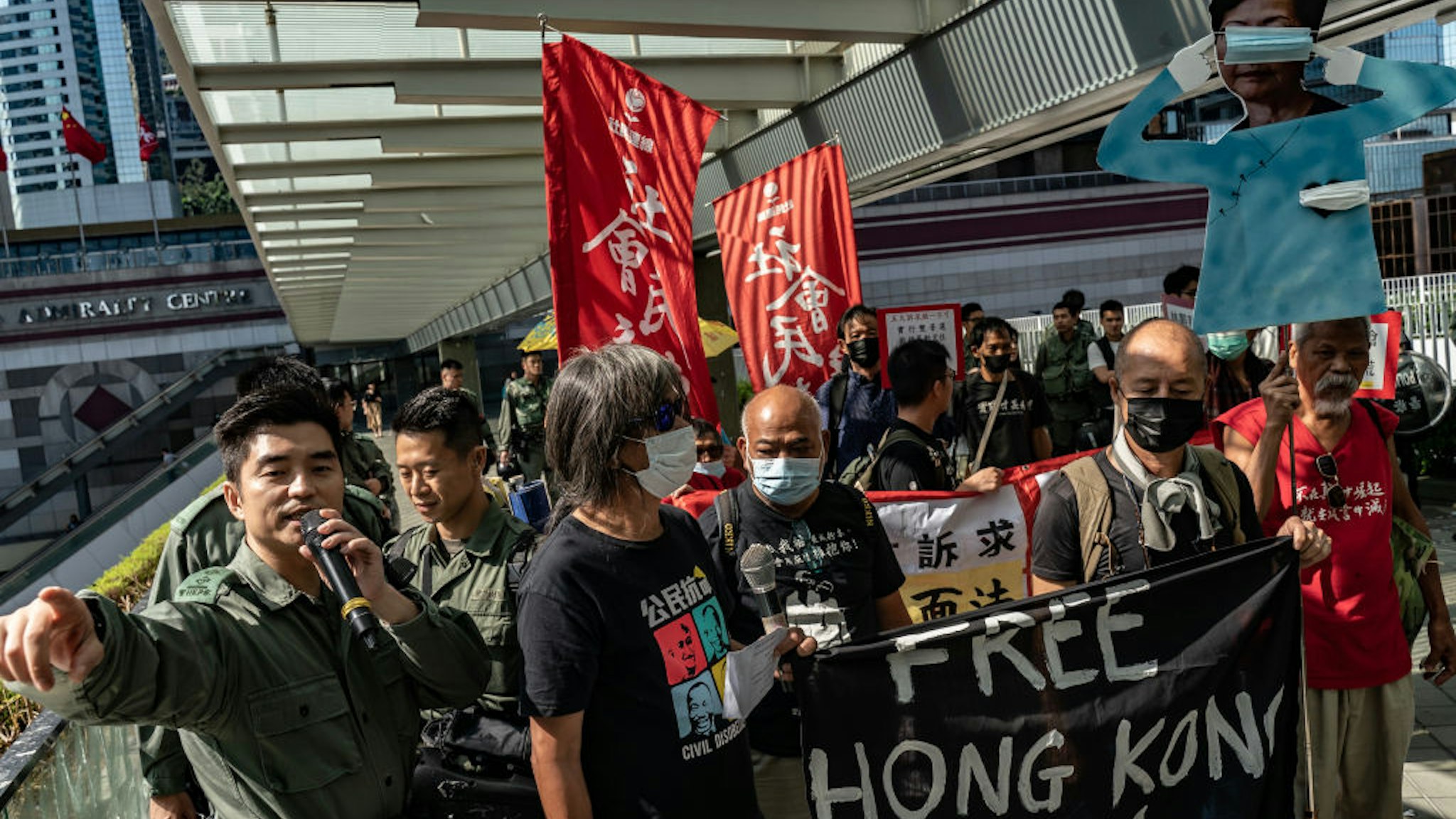 Pro-democracy protesters hold banners as they march during a rally ahead of Hong Kong Chief Executive Carrie Lams annual policy speech outside of Central Government Complex on October 16, 2019 in Hong Kong, China.