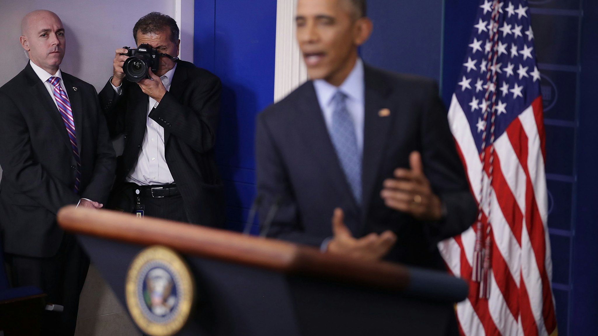 White House Chief Photographer Pete Souza makes images of U.S. President Barack Obama during the last news conference of his presidency in the Brady Press Briefing Room at the White House January 18, 2017 in Washington, DC. This was Obama's final question-and-answer session with reporters before New York real estate mogul and reality television personality Donald Trump is sworn in as the 45th president of the United States on Friday. (Photo by Chip Somodevilla/Getty Images)