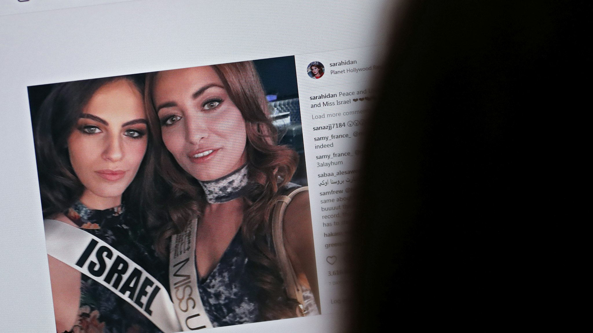 picture taken on November 21, 2017 shows a picture posted by the Instagram profile of Sarah Idan on November 14, who holds the titles of "Miss Iraq USA 2016" and "Miss Iraq Universe 2017", as she is seen taking a "selfie" photograph with Adar Gandelsman, who holds the title of "Miss Universe Israel 2017", with a caption reading: "Peace and Love from Miss Iraq and Miss Israel #missuniverse".