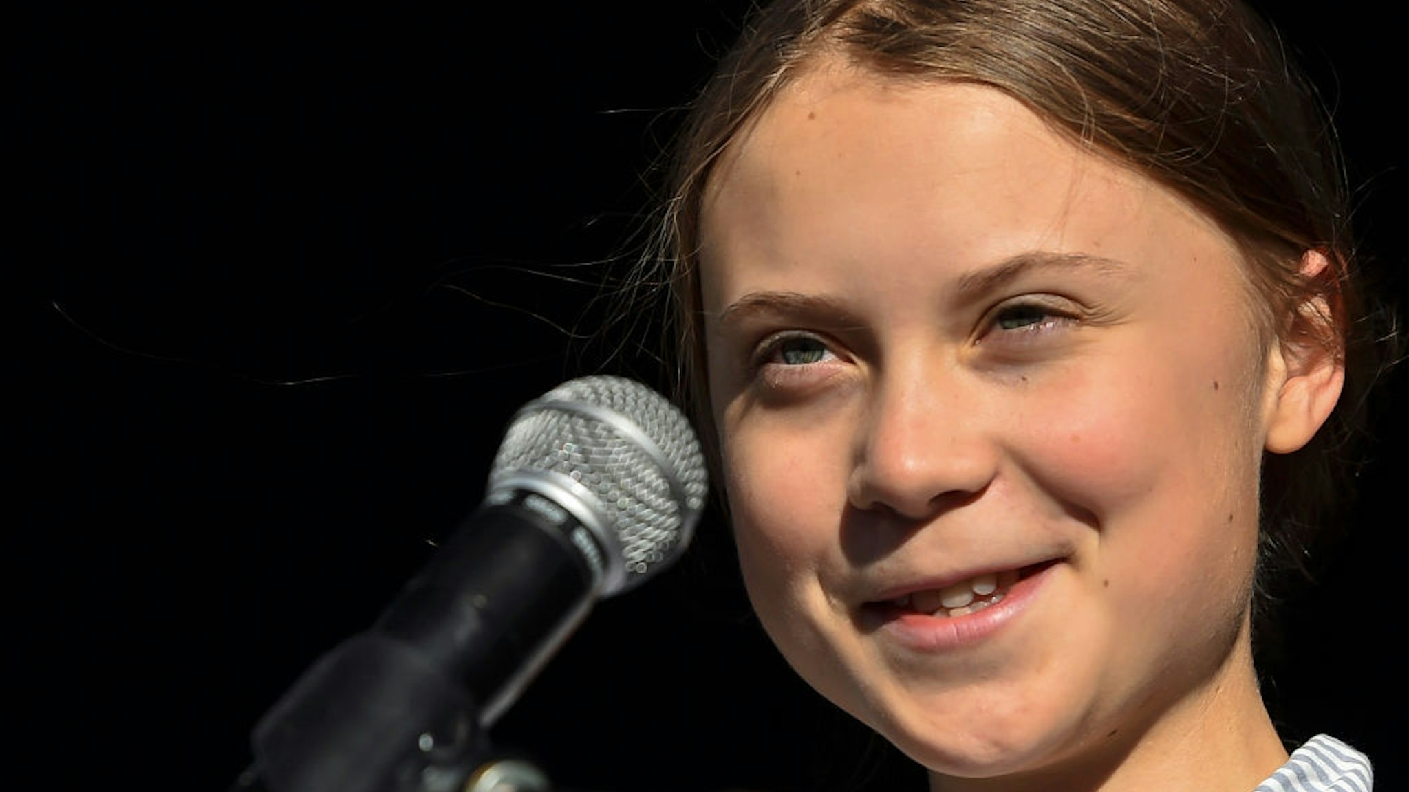 Swedish climate activist Greta Thunberg takes to the podium to address young activists and their supporters during the rally for action on climate change on September 27, 2019 in Montreal, Canada. Hundreds of thousands of people are expected to take part in what could be the city's largest climate march. (Photo by Minas Panagiotakis/Getty Images)