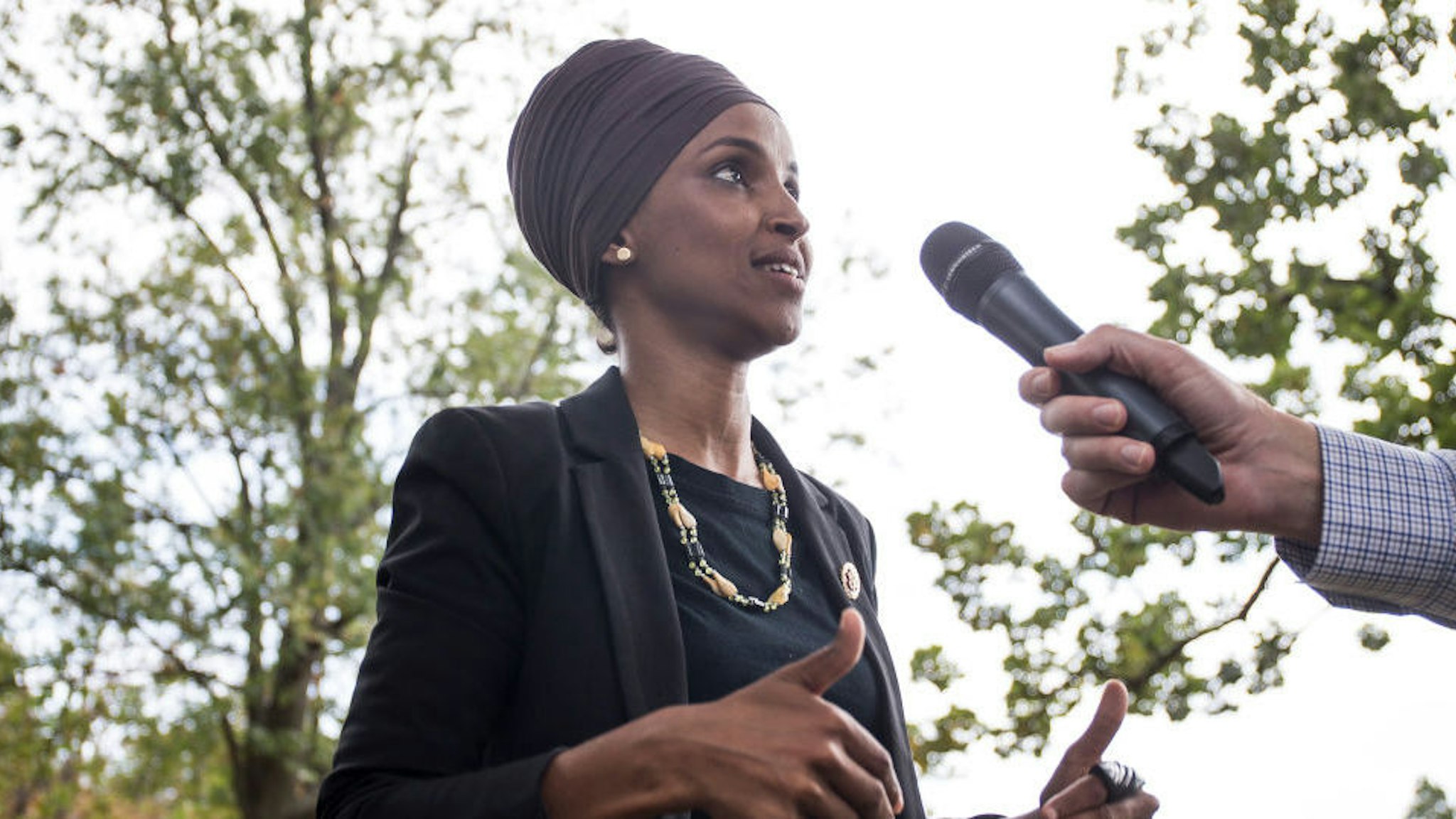 U.S. Rep. Ilhan Omar (D-MN) speaks to members of the press after delivering remarks at a rally hosted by Progressive Democrats of America on Capitol Hill on September 26, 2019 in Washington, DC. House Speaker Nancy Pelosi (D-CA) announced yesterday the beginning of a formal impeachment inquiry against President Donald Trump. (Photo by Zach Gibson/Getty Images)