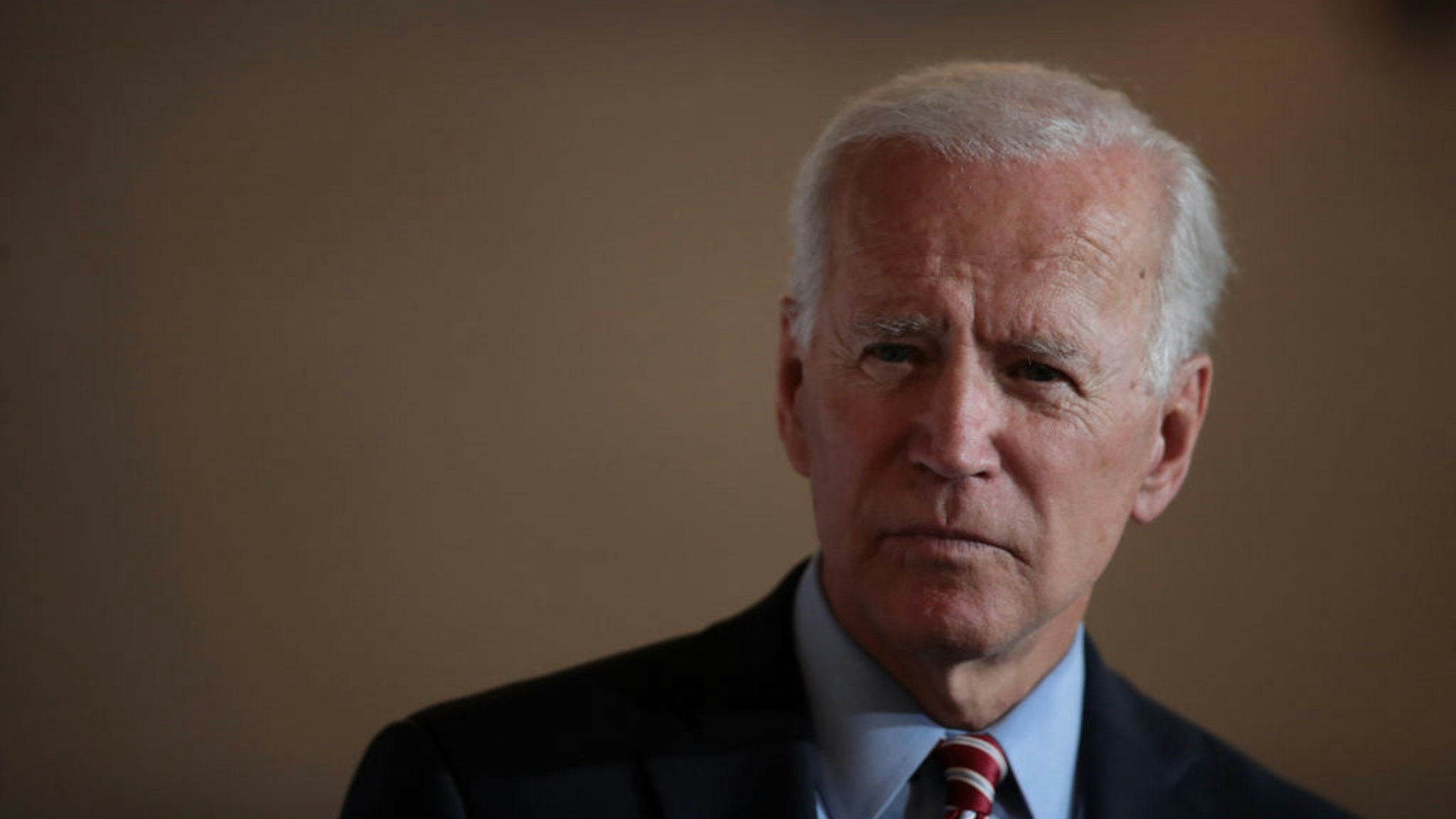 Joe Biden speaks to guests during a campaign stop at the Small Grand Things event center