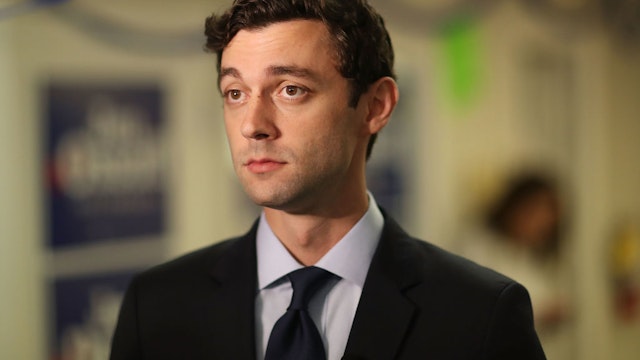 Jon Ossoff visits a campaign office to speak with volunteers and supporters on Election Day