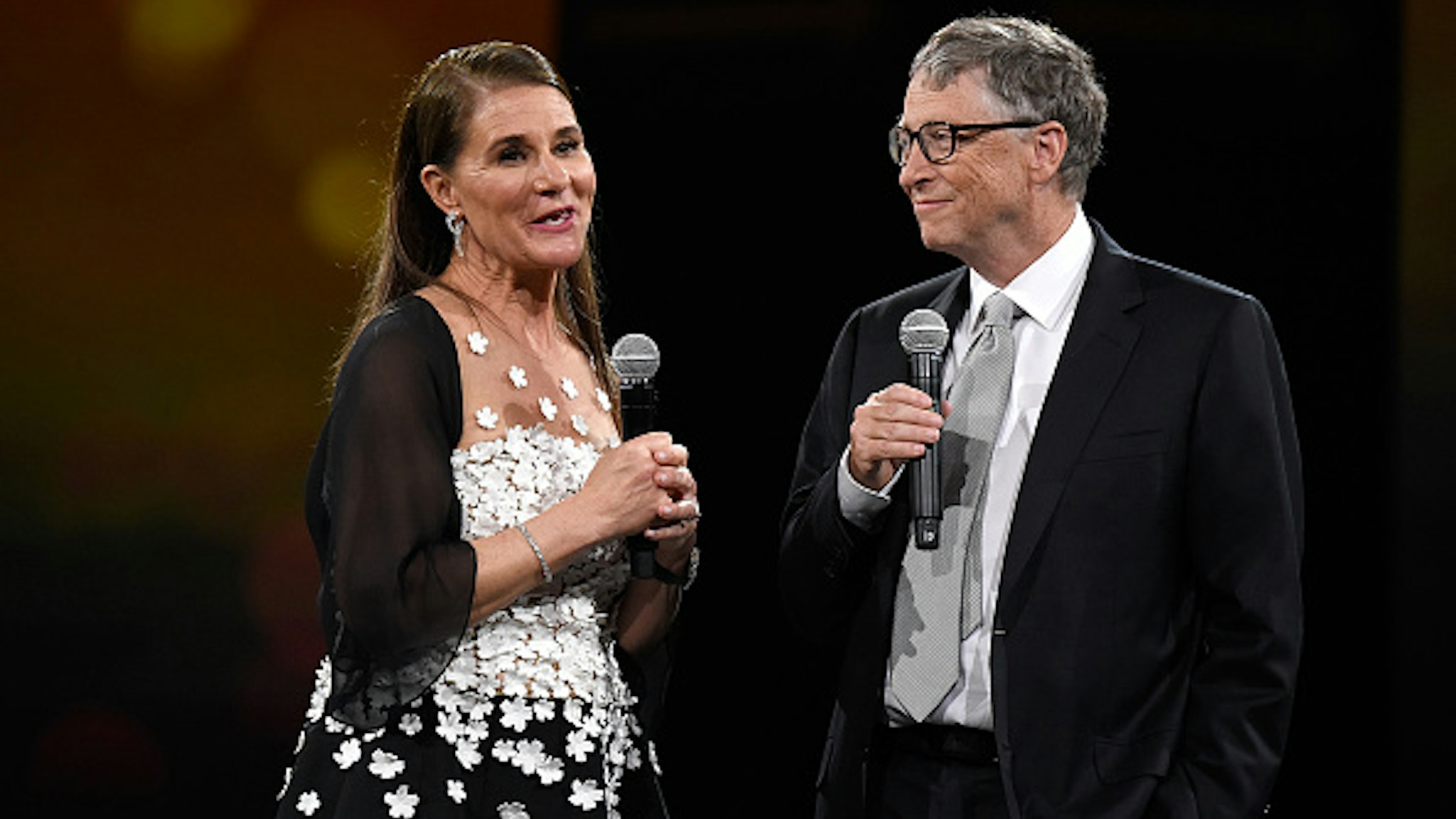 NEW YORK, NY - MAY 14: Melinda Gates and Bill Gates speak on stage during The Robin Hood Foundation's 2018 benefit at Jacob Javitz Center on May 14, 2018 in New York City.