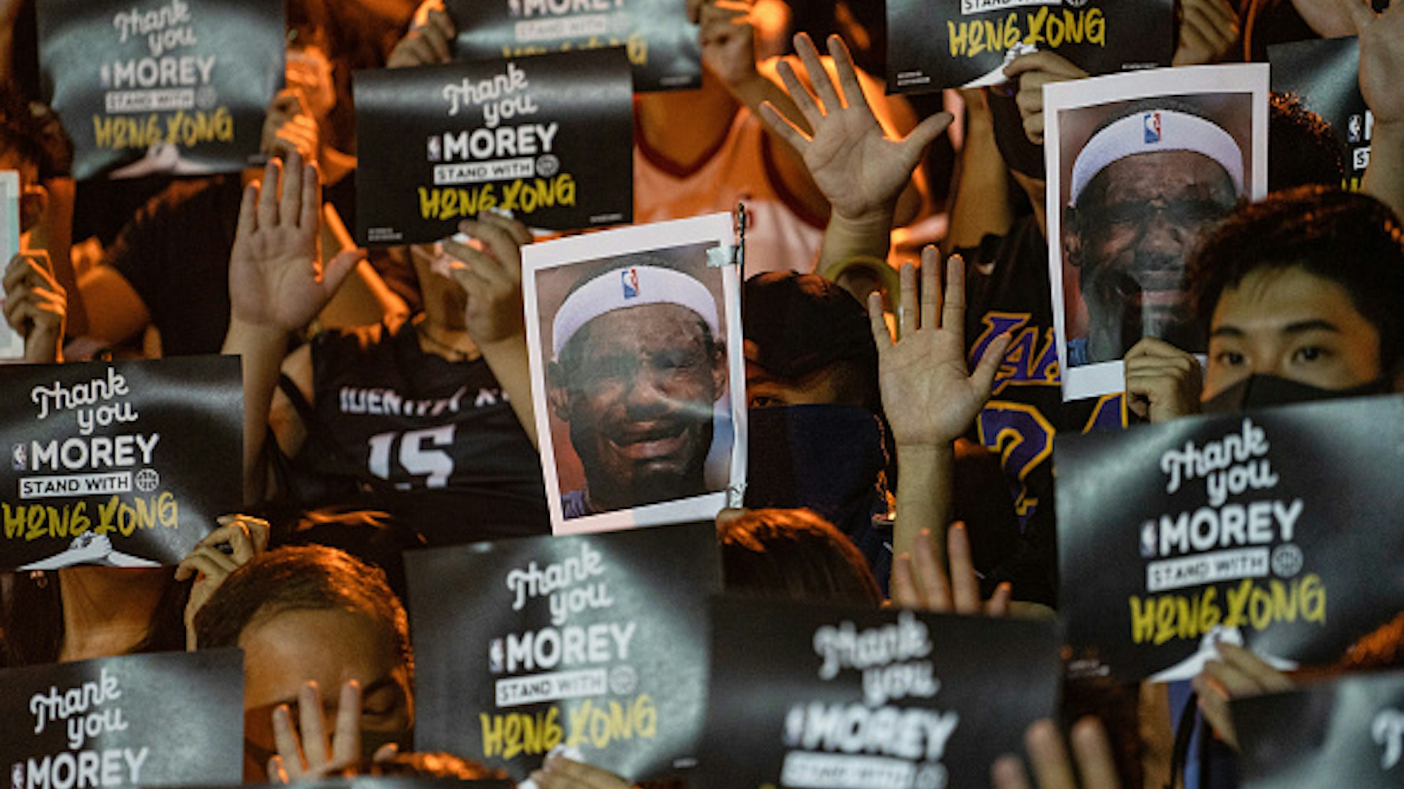 WAN CHAI, HONG KONG - 2019/10/15: Protesters using Lebron James pictures as masks during the demonstration. Hundreds of protesters gathered to express their anger about Lebron James's tweet and to show support to the General Manager of the Houston Rockets, Daryl Morey, and Adam Silver, Commissioner of the NBA, for defending freedom as a core value in NBA.