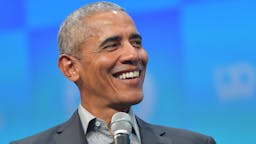 Obama MUNICH, GERMANY - SEPTEMBER 29: Former U.S. President Barack Obama speaks at the opening of the Bits & Pretzels meetup on September 29, 2019 in Munich, Germany. The annual event brings together founders and startups from across the globe for three days of networking, talks and inspiration. during the "Bits & Pretzels Founders Festival" at ICM Munich on September 29, 2019 in Munich, Germany. Bits & Pretzels is an application-only, three-day festival that connects 5,000 founders, investors, startup enthusiasts,taking place from September 29 to October 1, 2019.