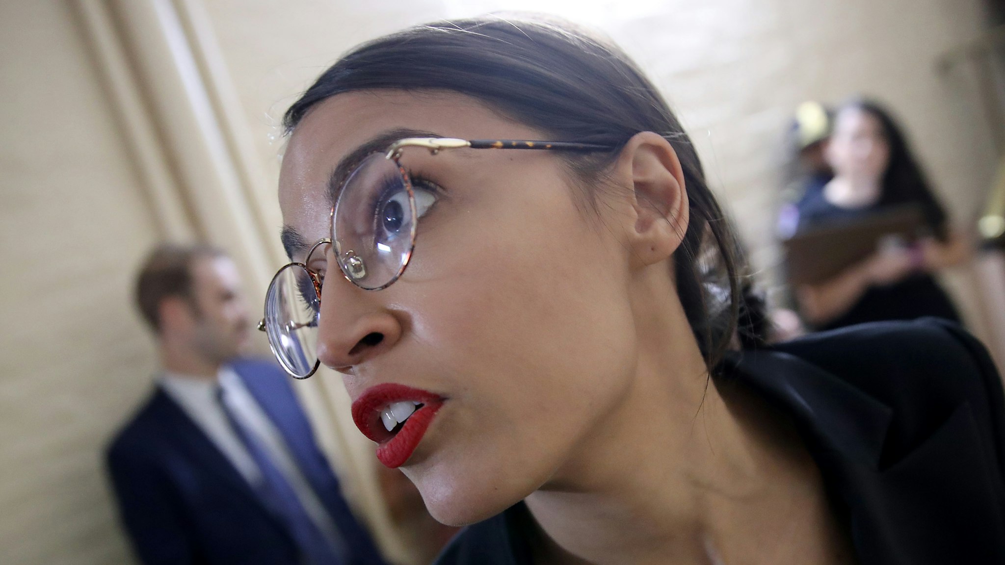 Rep. Alexandria Ocasio-Cortez (D-NY) answers questions from reporters while entering a House Democratic caucus meeting at the U.S. Capitol where formal impeachment proceedings against U.S. President Donald Trump were announced by Speaker of the House Nancy Pelosi September 24, 2019 in Washington, DC. Pelosi announced a formal impeachment inquiry after allegations that President Donald Trump sought to pressure the president of Ukraine to investigate leading Democratic presidential contender, former Vice President Joe Biden and his son, which was the subject of a reported whistle-blower complaint that the Trump administration has withheld from Congress.