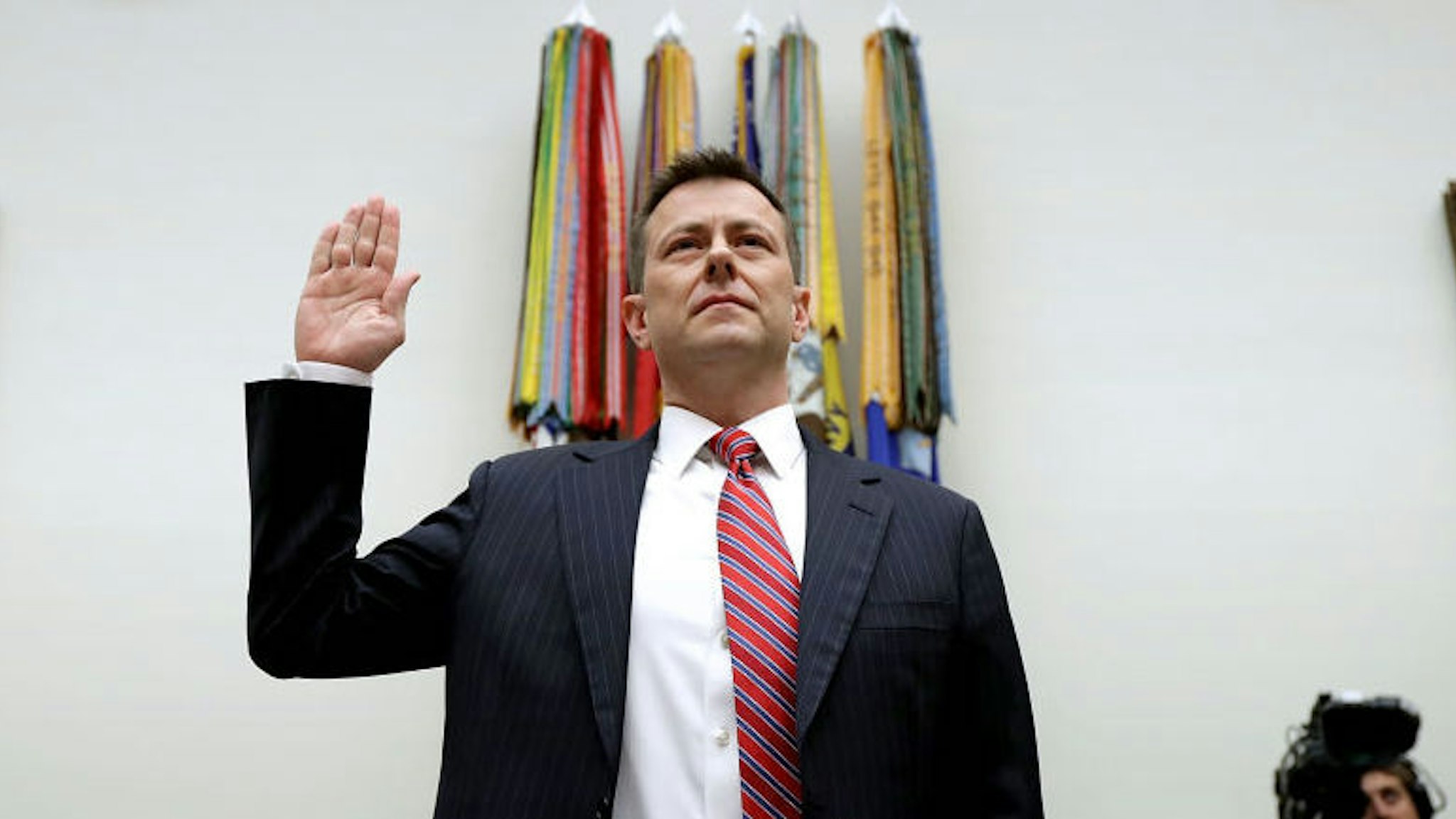Deputy Assistant FBI Director Peter Strzok is sworn in before a joint committee hearing of the House Judiciary and Oversight and Government Reform committees in the Rayburn House Office Building on Capitol Hill July 12, 2018 in Washington, DC. While involved in the probe into Hillary ClintonÕs use of a private email server in 2016, Strzok exchanged text messages with FBI attorney Lisa Page that were critical of Trump. After learning about the messages, Mueller removed Strzok from his investigation into whether the Trump campaign colluded with Russia to win the 2016 presidential election. (Photo by Chip Somodevilla/Getty Images)