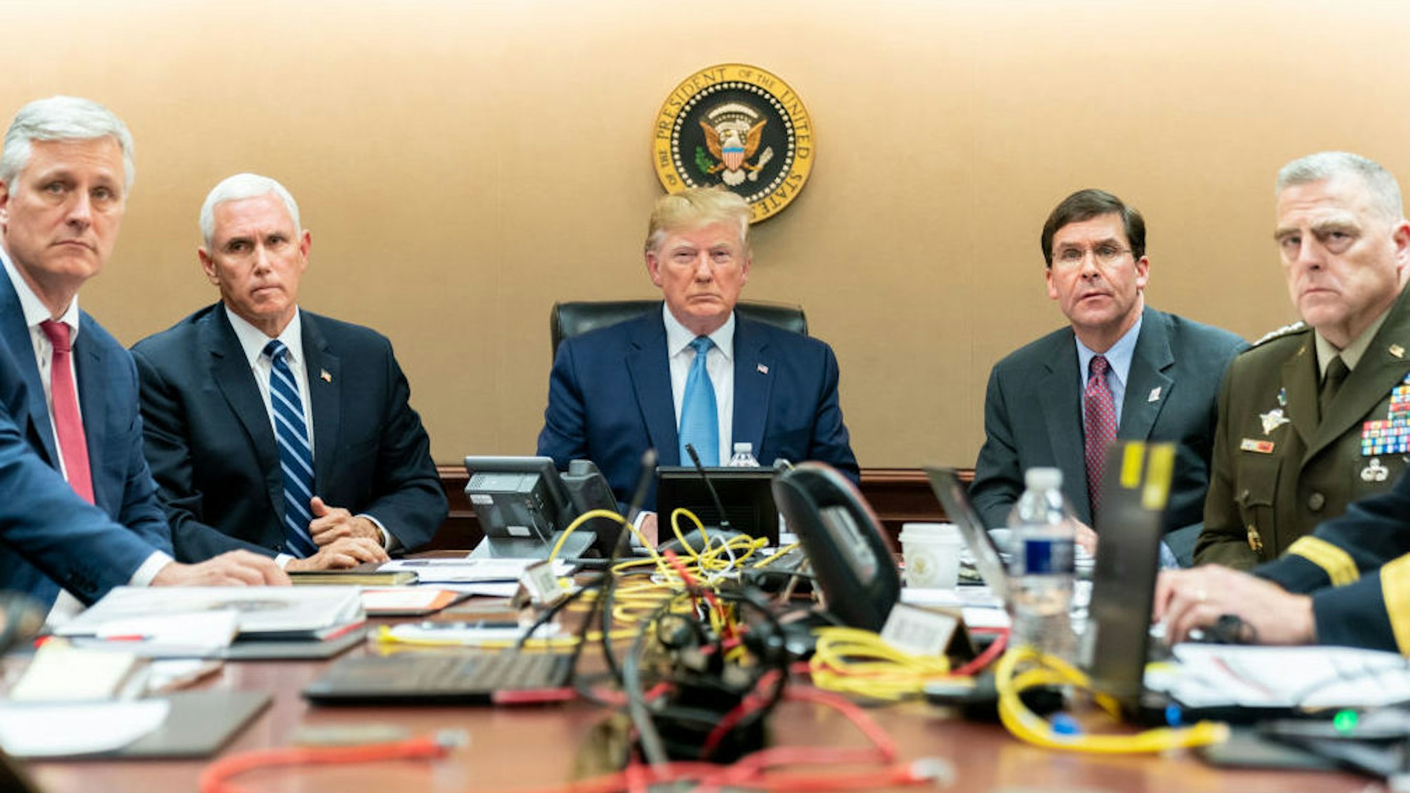 WASHINGTON, DC - OCTOBER 26: In this handout photo provided by the White House, President Donald J. Trump is joined by Vice President Mike Pence (2nd L), National Security Advisor Robert O‚ÄôBrien (L), Secretary of Defense Mark Esper (2nd R) and Chairman of the Joint Chiefs of Staff U.S. Army General Mark A. Milley in the Situation Room of the White House October 26, 2019 in Washington, DC. The President was monitoring developments as U.S. Special Operations forces close in on ISIS leader Abu Bakr al-Baghdadi‚Äôs compound in Syria with a mission to kill or capture the terrorist.