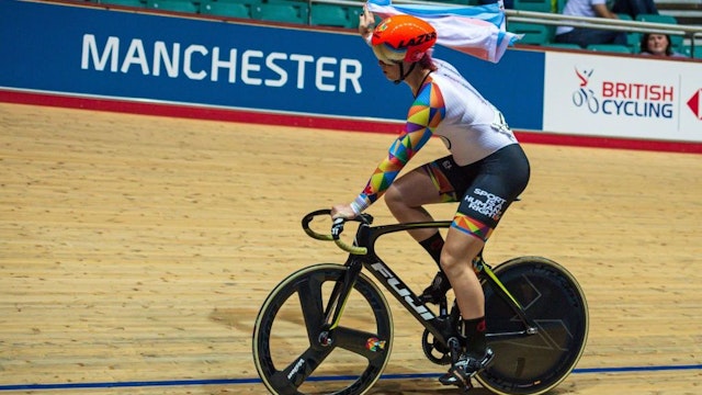Canadian cyclist Rachel McKinnon carries a Transgender Pride flag as she celebrates winning the F35-39 Sprint Final during the 2019 UCI Track Cycling World Masters Championship, in Manchester on October 19, 2019. - Transgender cyclist Rachel McKinnon has defended her right to compete in women's sport despite accepting trans athletes may retain a physical advantage over their rivals. (Photo by OLI SCARFF / AFP) (Photo by OLI SCARFF/AFP via Getty Images