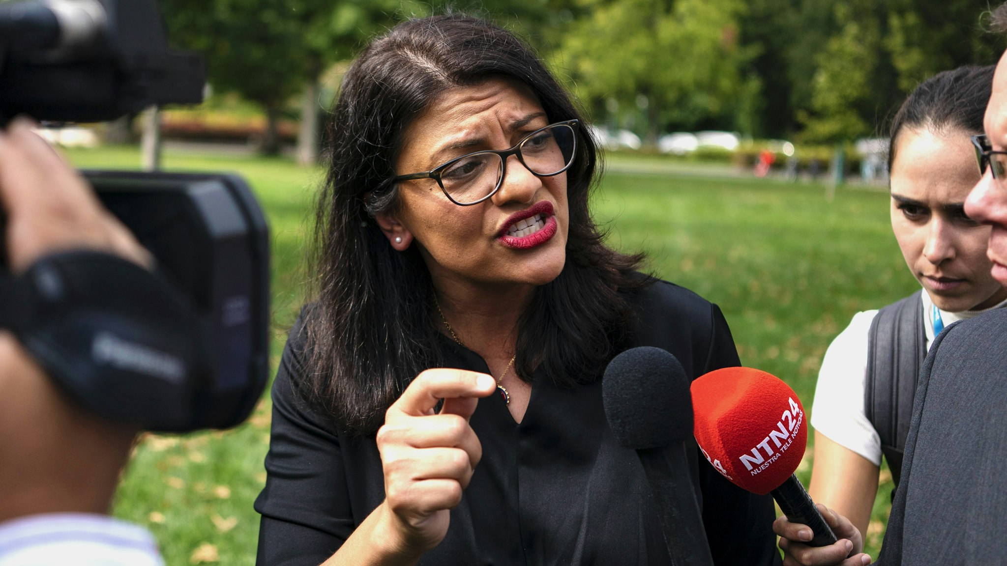 Representative Rashida Tlaib, a Democrat from Michigan, speaks with members of the media following a rally held in support of impeaching U.S. President Donald Trump in Washington, D.C., U.S., on Thursday, Sept. 26, 2019. House Speaker Nancy Pelosi announced that the House would begin an impeachment inquiry against Trump related to a whistle-blower complaint alleging troubling interactions between Trump and the president of Ukraine.