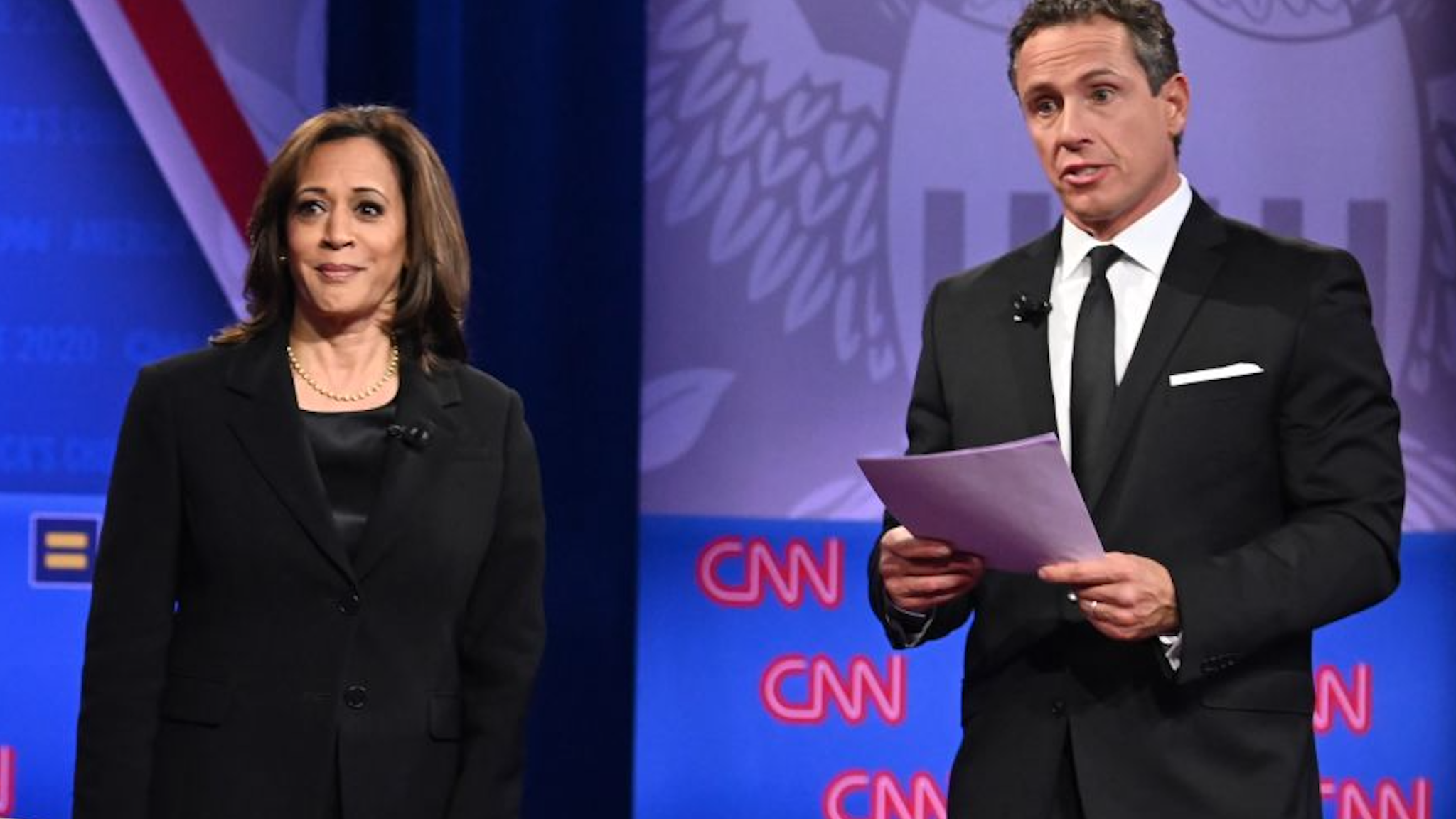 Democratic presidential hopeful California Senator Kamala Harris (L) speaks on stage alongside CNN moderator Chris Cuomo during a town hall devoted to LGBTQ issues hosted by CNN and the Human rights Campaign Foundation at The Novo in Los Angeles on October 10, 2019.