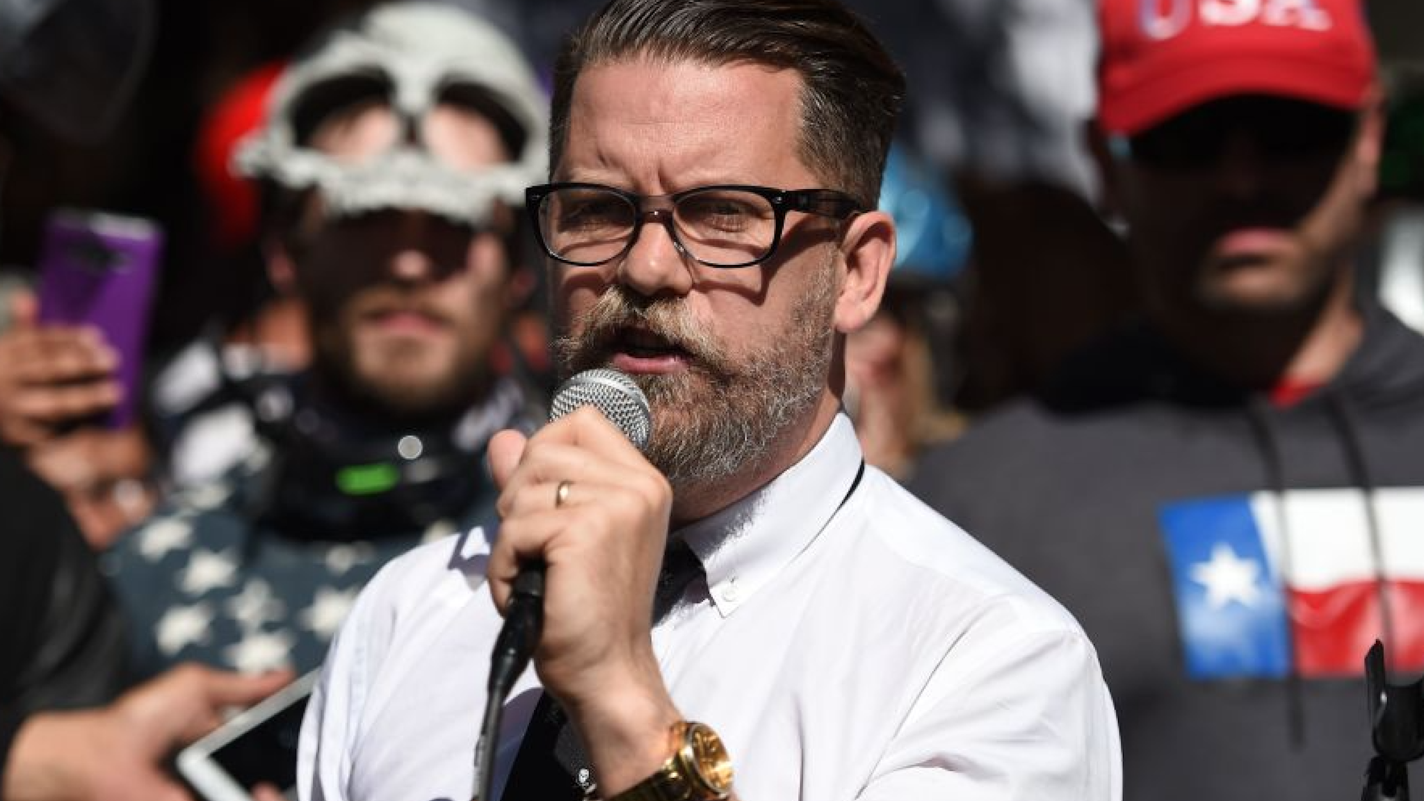 Vice Media co-founder and conservative speaker Gavin McInnes reads a speech written by Ann Coulter to a crowd during a conservative rally in Berkeley, California on April 27, 2017.
