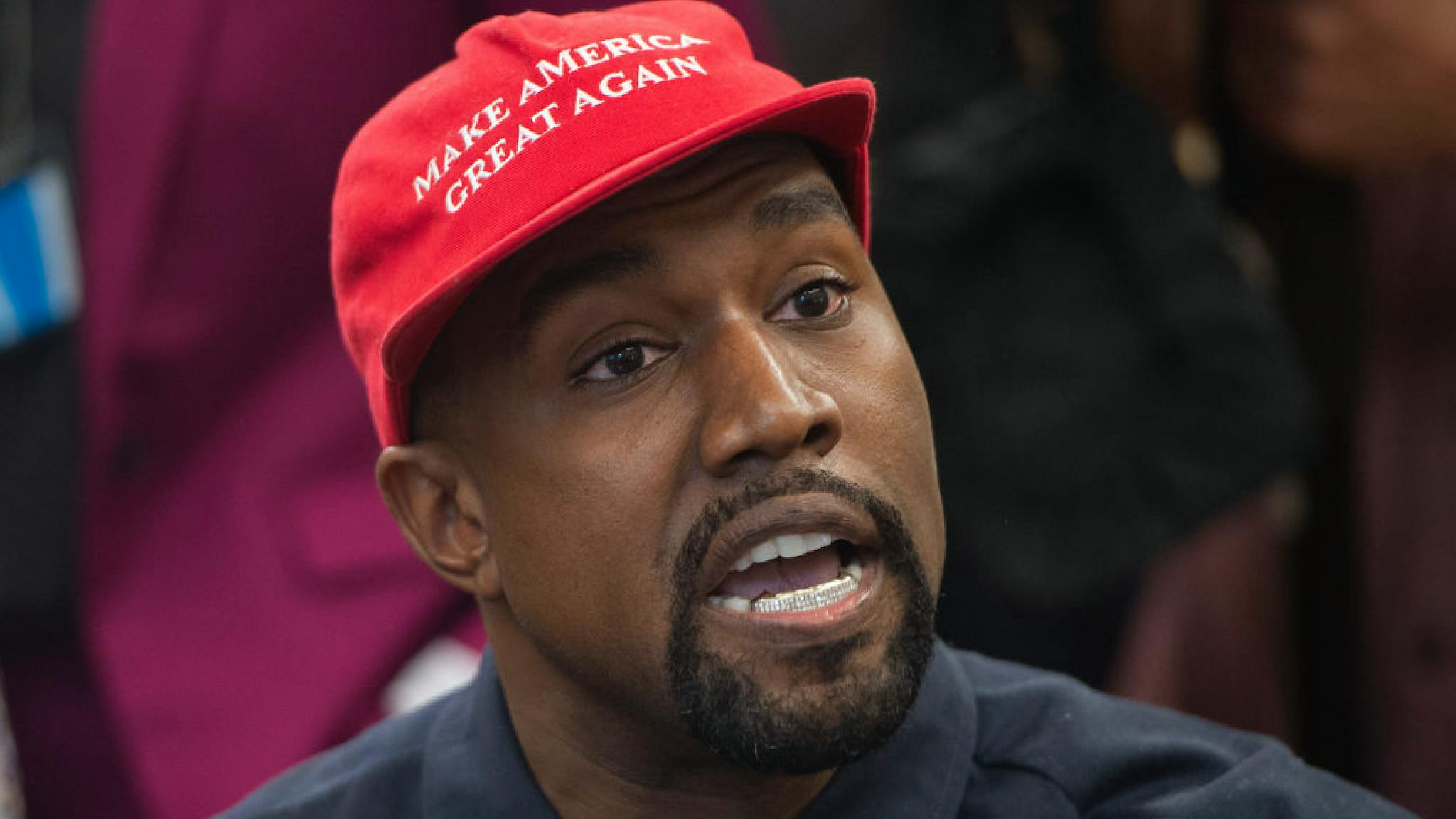 Kanye West MAGA Hat Rapper Kanye West speaks during his meeting with US President Donald Trump in the Oval Office of the White House in Washington, DC, on October 11, 2018.