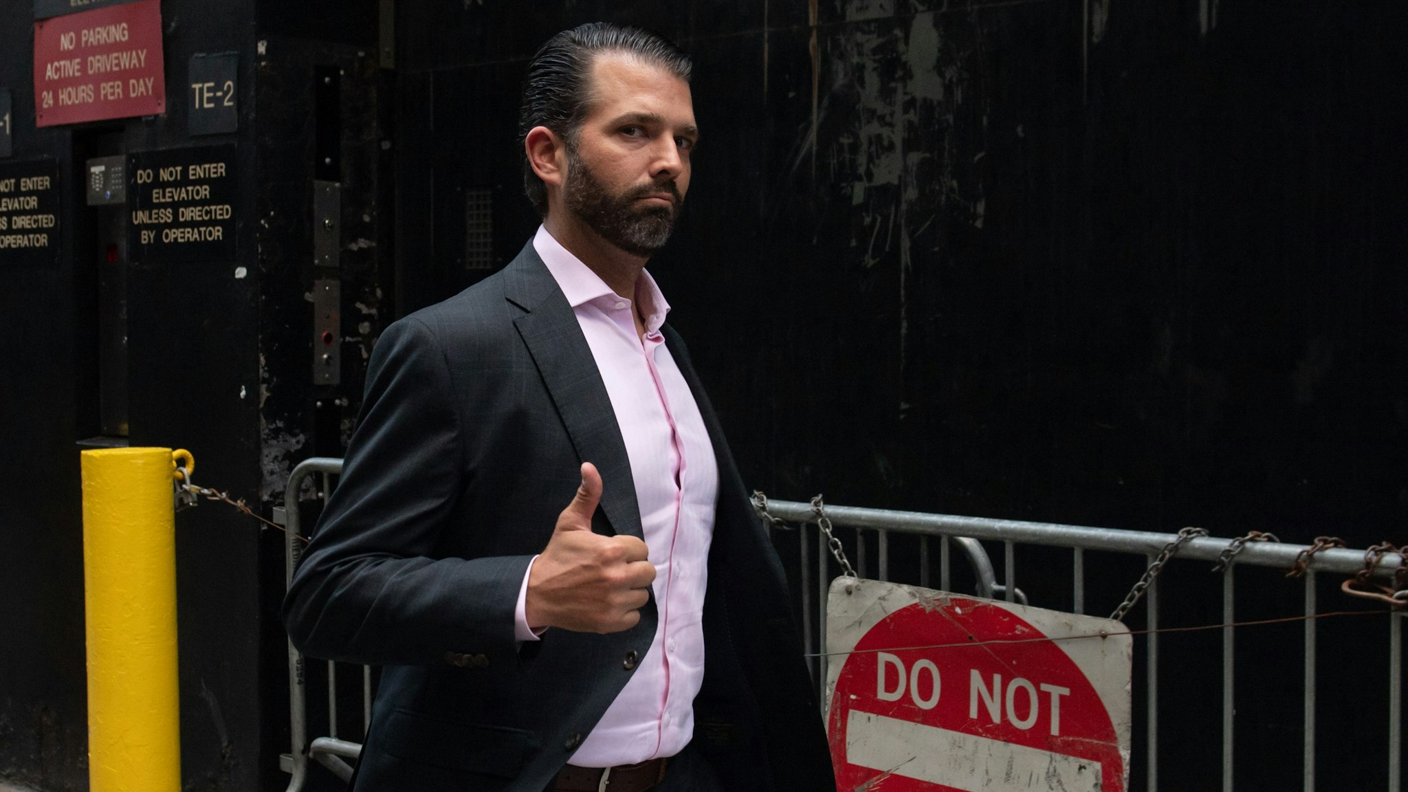 Donald Trump, Jr., son of US President Donald Trump, gives a thumbs-up as he walks outside of Trump Tower in New York, September 24, 2019.
