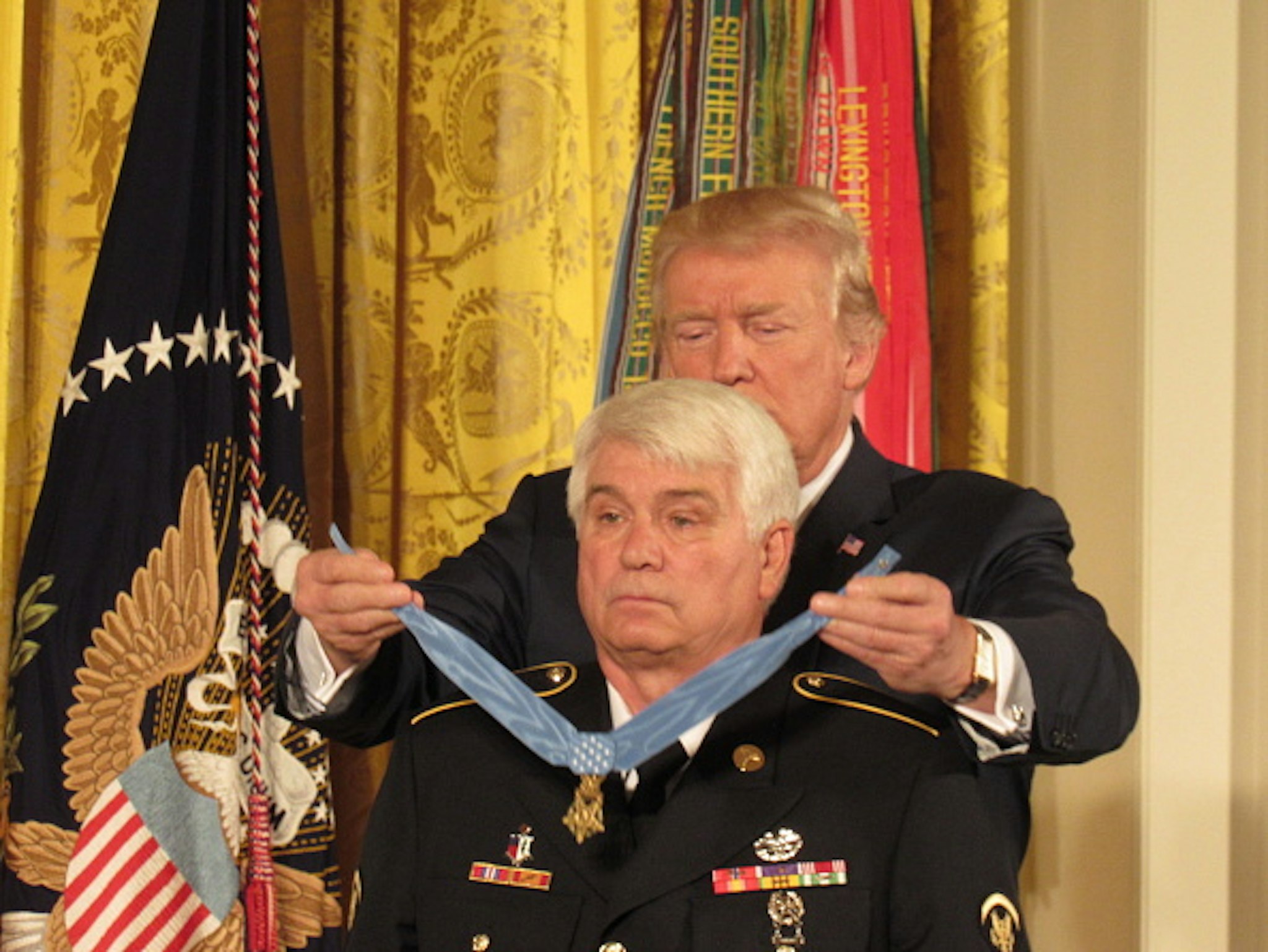 U.S. President Donald Trump presents the Medal of Honor to former Army Specialist James McCloughan (L) of South Haven, Michigan, during an East Room ceremony at the White House July 31, 2017 in Washington, DC. McCloughan is awarded with the medal for his heroic acts as a combat medic during the Vietnam War. .