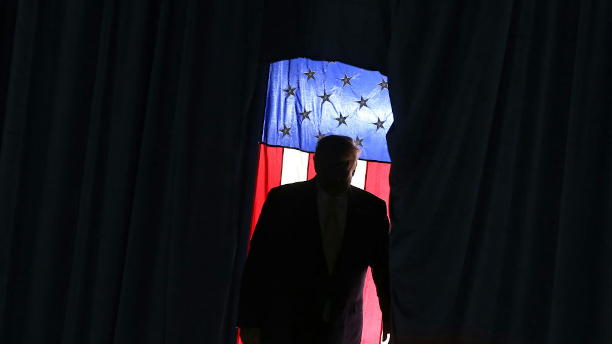 U.S. President Donald Trump walks onto stage during a campaign rally at Sudduth Coliseum on October 11, 2019 in Lake Charles, Louisiana.