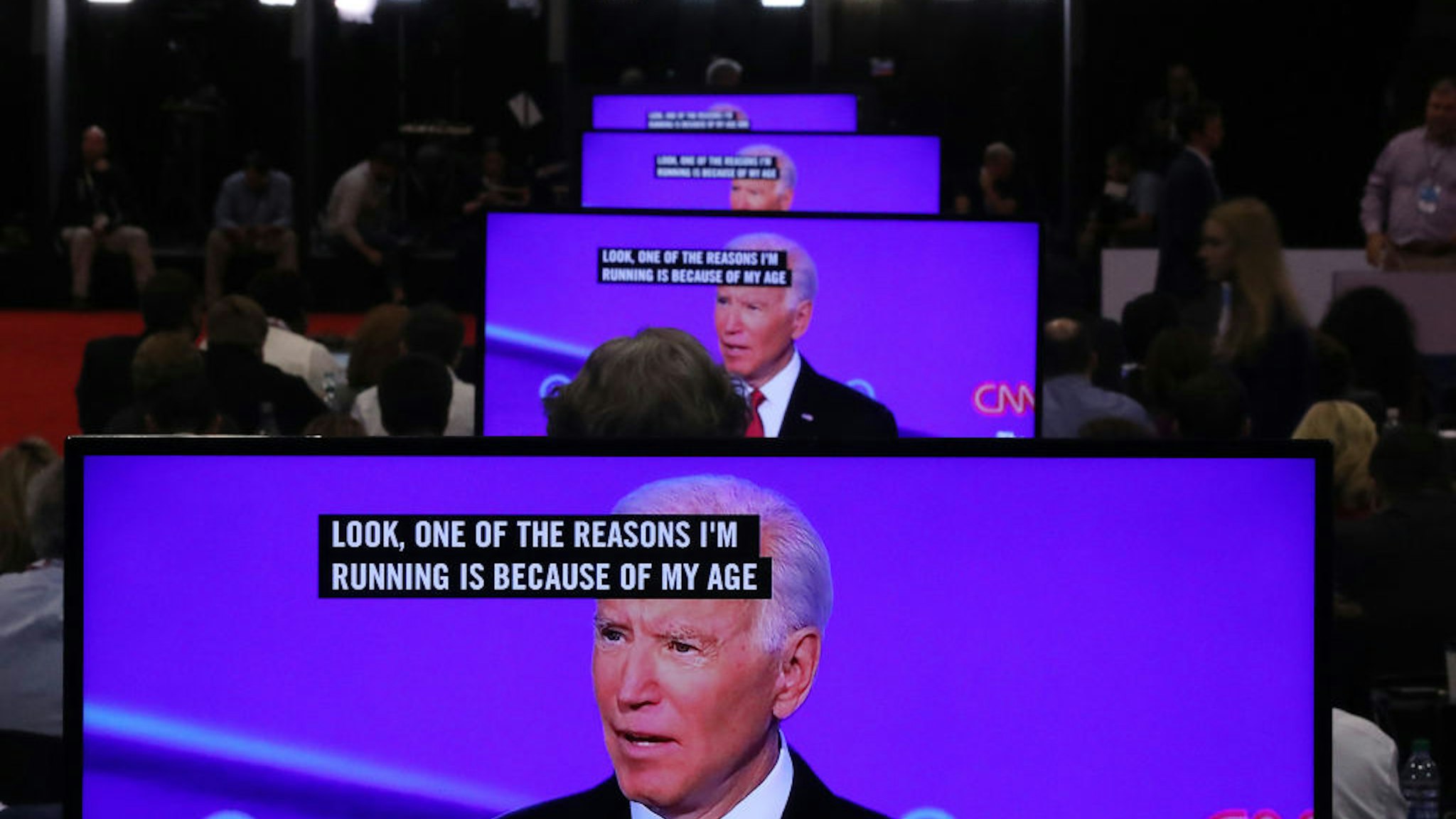Former Vice President Joe Biden appears on television screens in the Media Center during the Democratic Presidential Debate at Otterbein University on October 15, 2019 in Westerville, Ohio. A record 12 presidential hopefuls are participating in the debate hosted by CNN and The New York Times. (Photo by Chip Somodevilla/Getty Images)