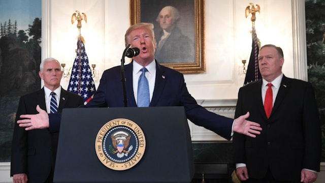 US President Donald Trump speaks about Syria in the Diplomatic Reception Room at the White House in Washington, DC, October 23, 2019 as US Vice President Mike Pence(L) and US Secretary of State Mike Pompeo look on. - President Donald Trump announced on Wednesday the United States would be lifting sanctions on Turkey,