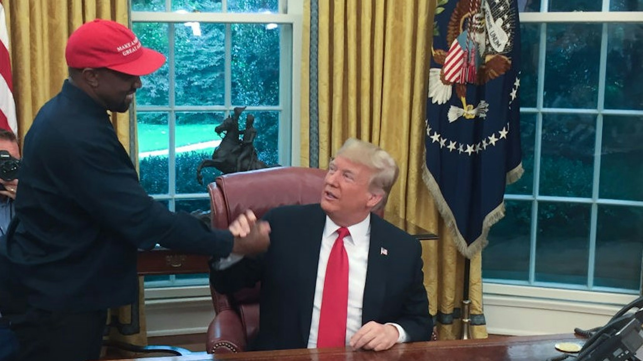 President Donald Trump meets with rapper Kanye West in the Oval Office of the White House in Washington, DC, October 11, 2018. (Photo by SEBASTIAN SMITH / AFP) (Photo credit should read SEBASTIAN SMITH/AFP/Getty Images)