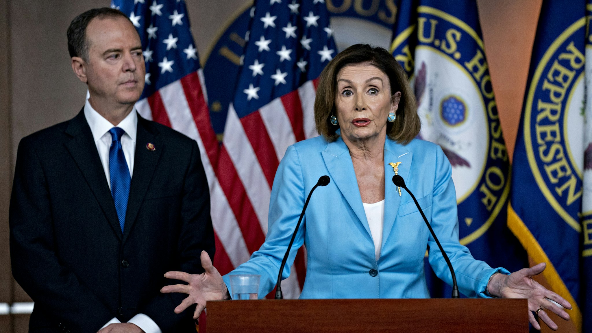 U.S. House Speaker Nancy Pelosi, a Democrat from California, speaks as Representative Adam Schiff, a Democrat from California and chairman of the House Intelligence Committee, left, listens during a news conference on Capitol Hill in Washington, D.C., U.S., on Wednesday, Oct. 2, 2019. Three House committee chairmen threatened on Wednesday to subpoena the White House if it fails to adhere by Friday to document requests related to allegations that President Donald Trump pressured Ukraine into investigating one of his leading political rivals.