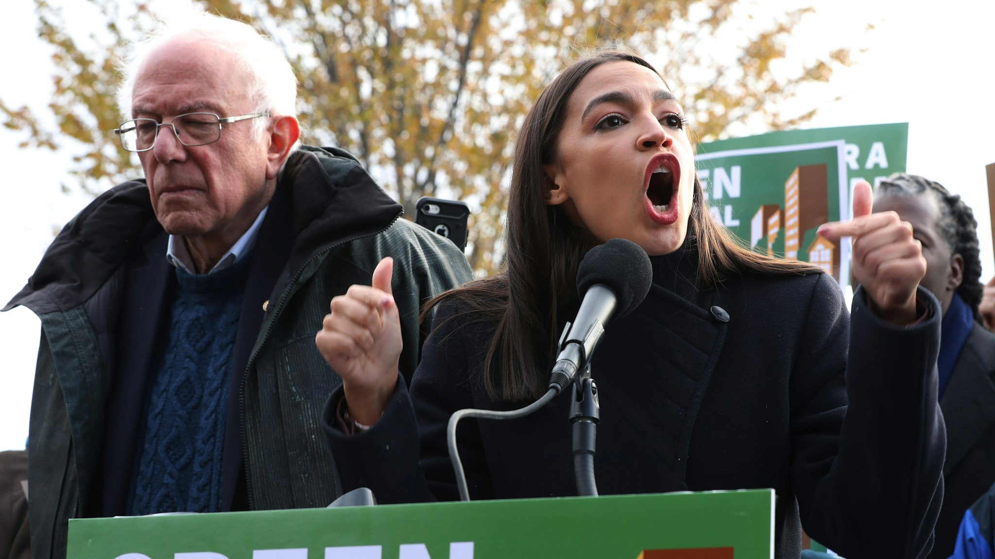 Democratic presidential candidate Sen. Bernie Sanders (I-VT) (L) and Rep. Alexandria Ocasio-Cortez (D-NY) hold a news conference to introduce legislation to transform public housing as part of their Green New Deal proposal outside the U.S. Capitol November 14, 2019 in Washington, DC. The liberal legislators invited affordable housing advocates and climate change activists to join them for the announcement.