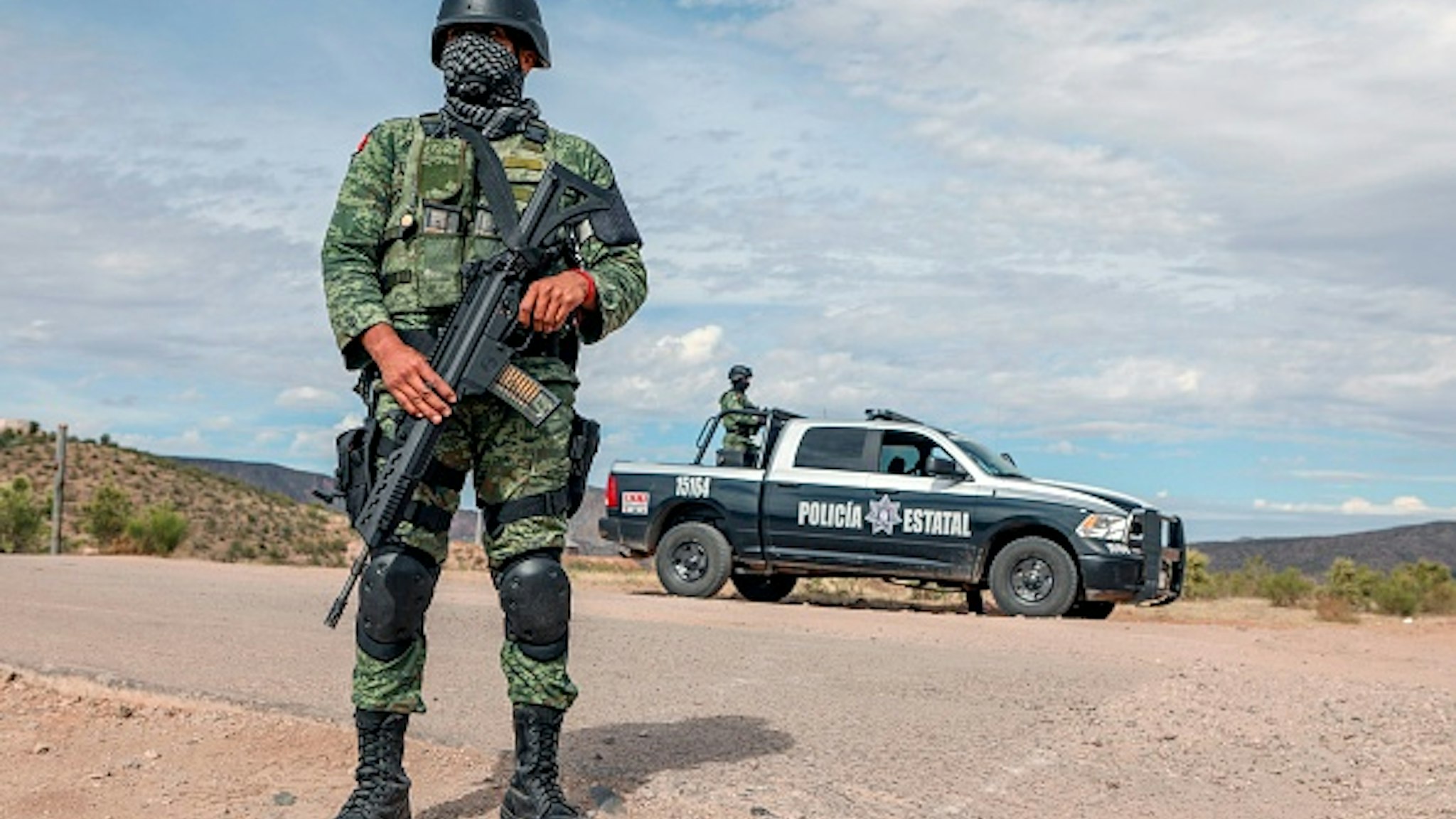 Members of the National Guard stand guard near La Morita ranch, belonging to the Mexican-American LeBaron family -of which nine members were killed in a hail of bullets on November 4- in Bavispe, Sonora state, Mexico, on November 6, 2019. - Mexican authorities said Wednesday they believe a drug cartel called "La Linea" was responsible for the murder of the three women and six children, saying the massacre was committed with American-made ammunition. Eight other children managed to escape, six of them wounded.