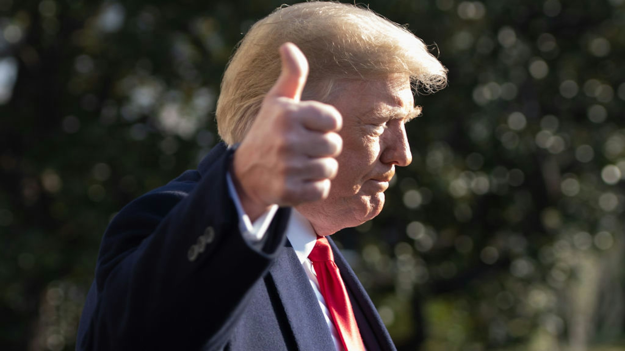 US President Donald Trump gives a thumbs-up as he speaks to the press as he walks to Marine One prior to departing from the South Lawn of the White House in Washington, DC, December 7, 2018. - Trump is traveling to Kansas City, Missouri. (Photo by SAUL LOEB / AFP) (Photo by SAUL LOEB/AFP via Getty Images)